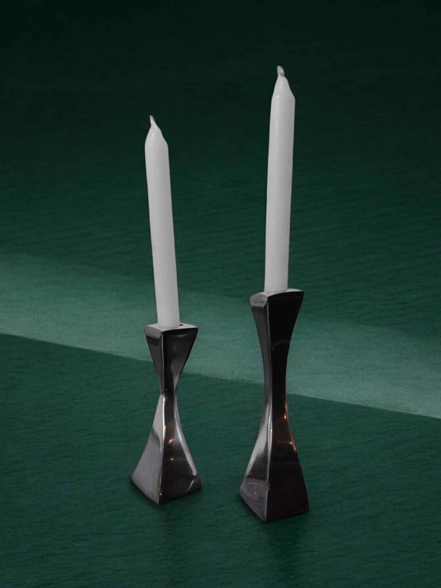 Pair of Swan candlesticks by Matthew Hilton, England, 1980