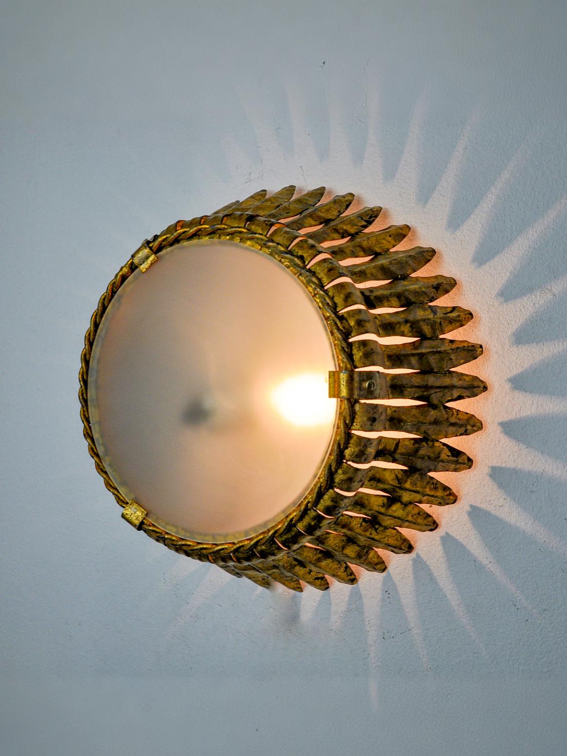 Sun wall lamp by ferro arte, metal and gold leaf, Spain, 1960