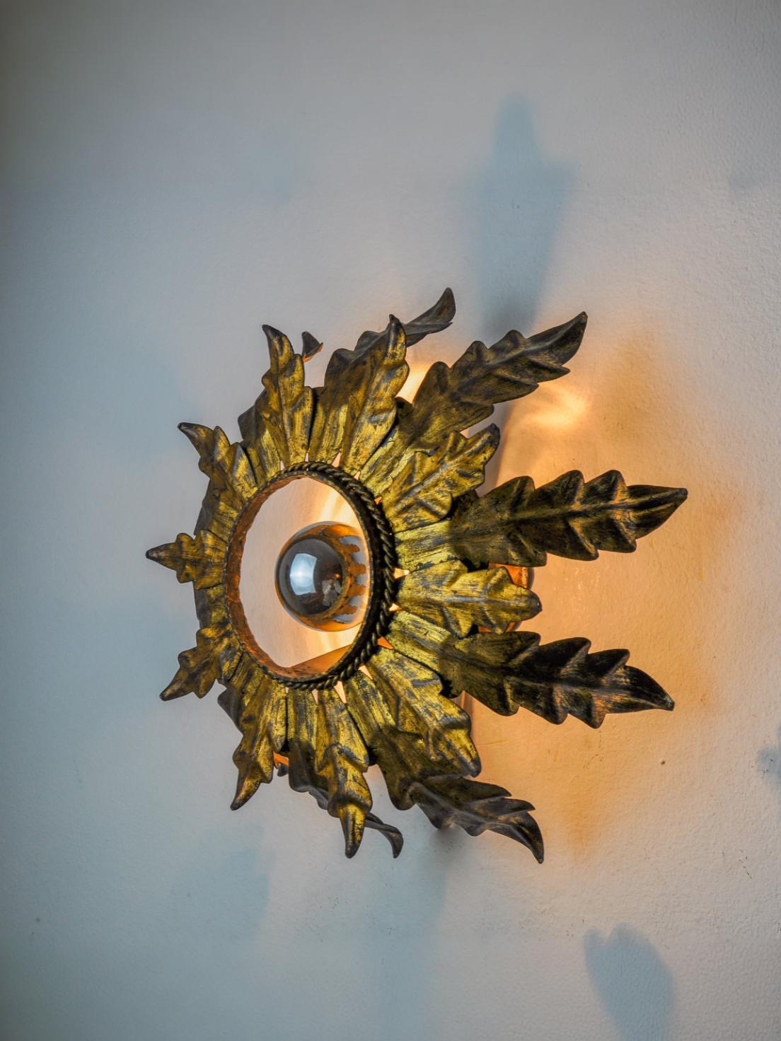 Sun wall lamp by ferro arte, metal and gold leaf, Spain, 1960