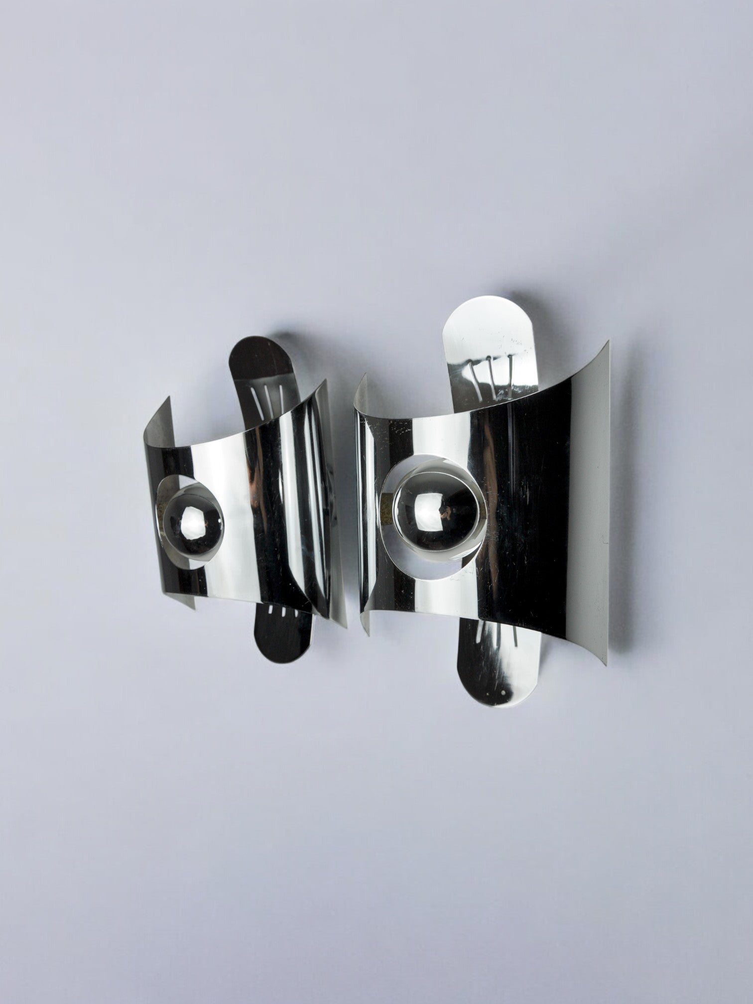 Pair of space age wall lights, chromed metal, Italy, 1970