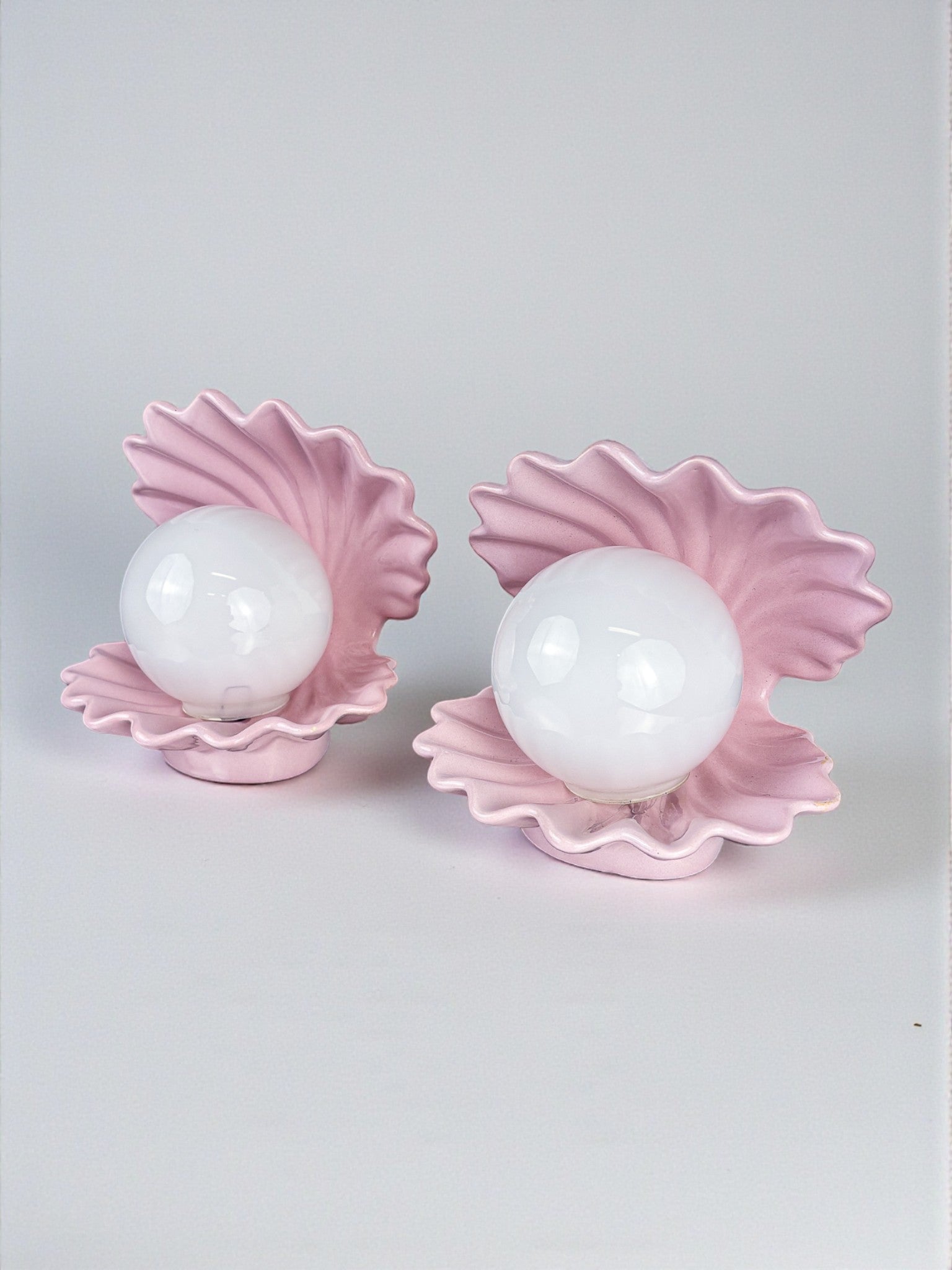 Pair of pink ceramic shell-shaped table lamps, Italy, 1970s