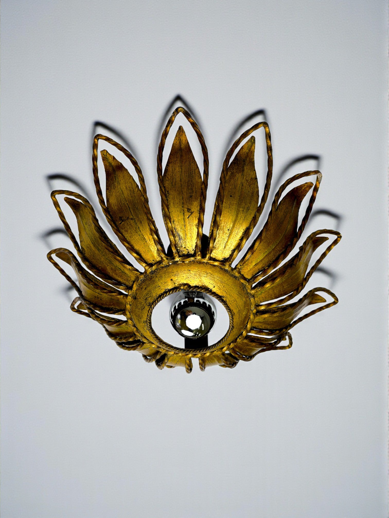Spanish Sunburst ceiling light fixture or sconce in Gilt Iron, Circa 1960