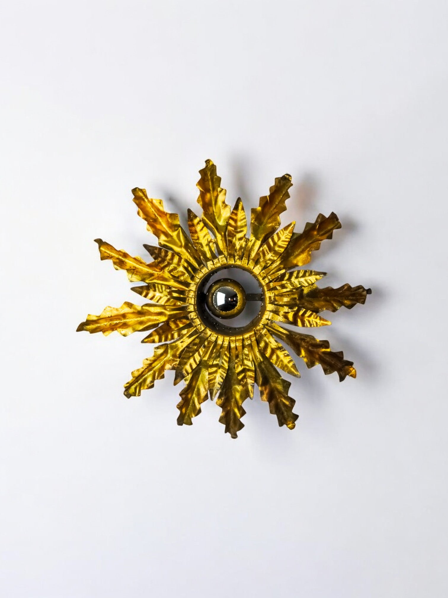 Brutalist sun wall lamp, metal and gold leaf, Italy, 1960