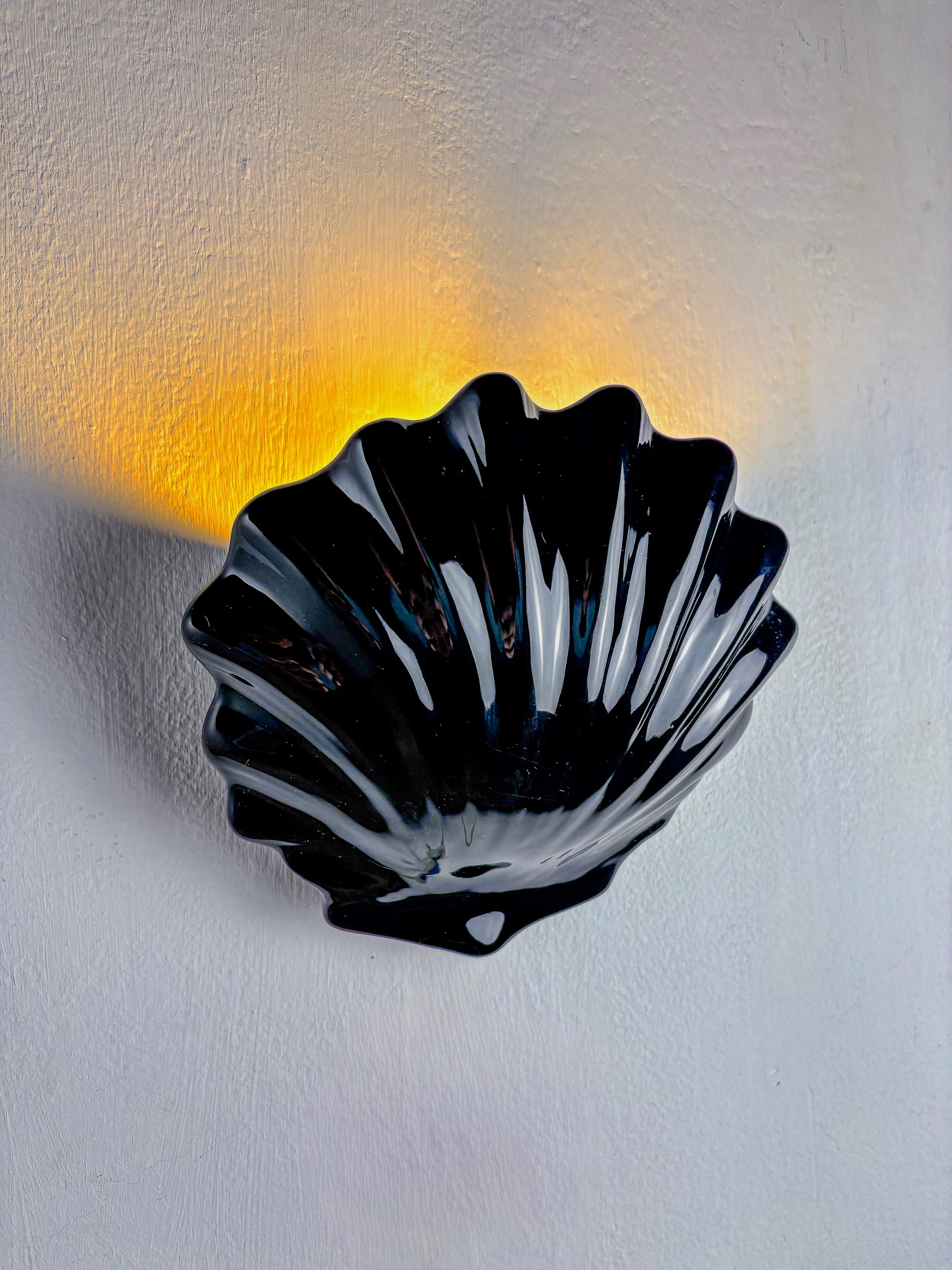 Italian shell-shaped wall sconce, black ceramic, 1970's