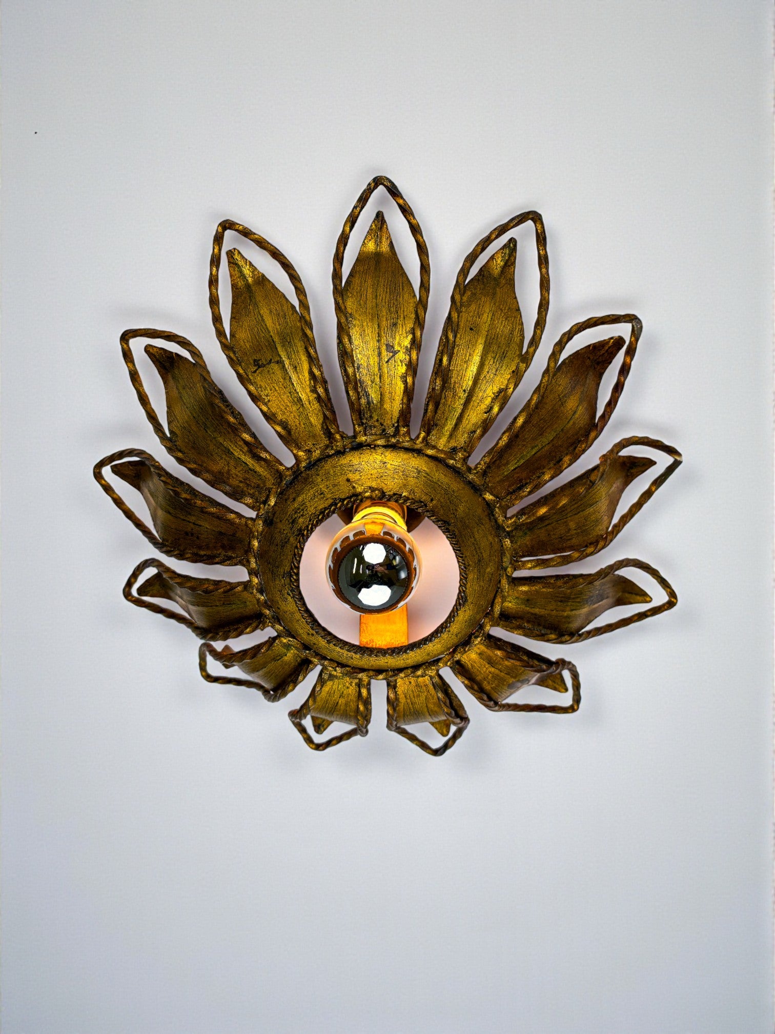 Spanish Sunburst ceiling light fixture or sconce in Gilt Iron, Circa 1960
