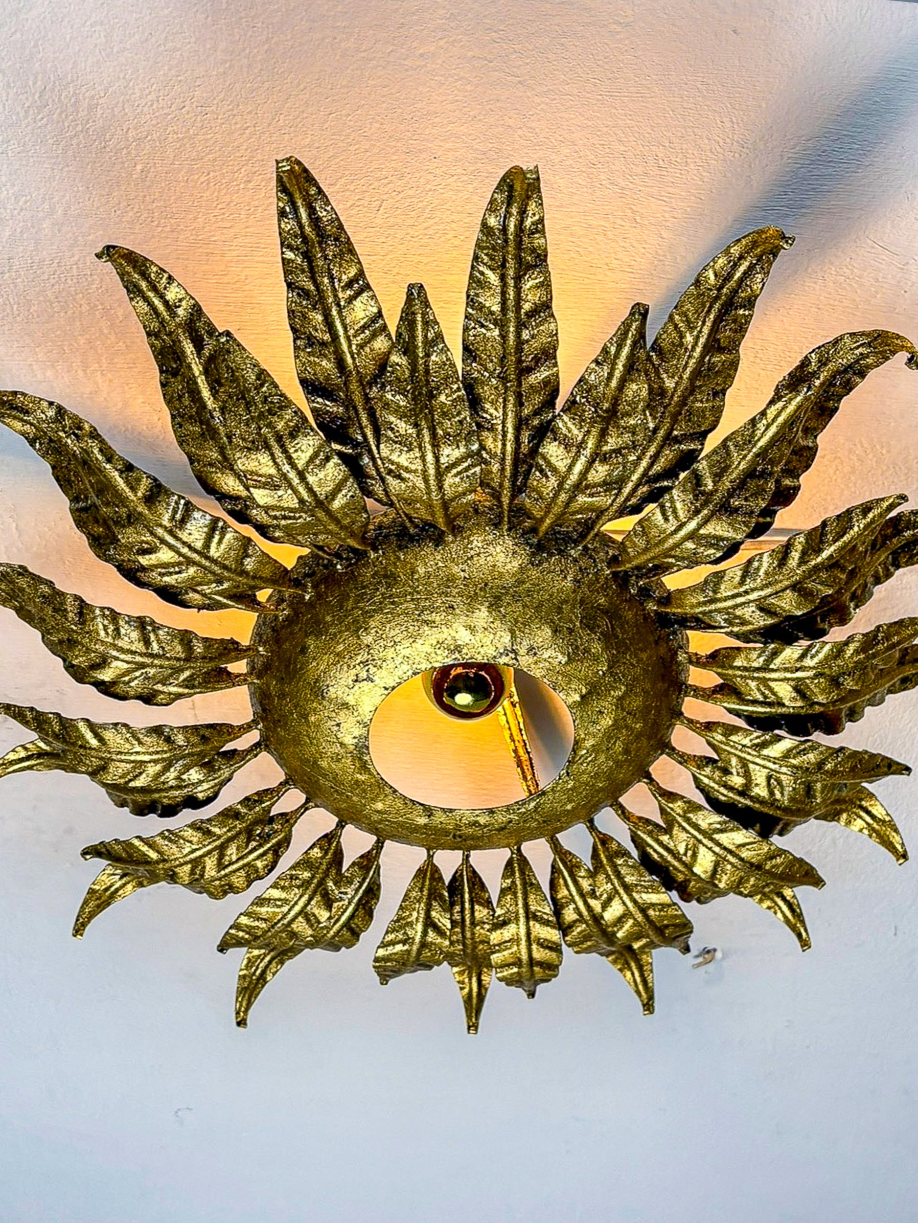 Spanish Sunburst ceiling light fixture or sconce in Gilt Wrought Iron, Circa 1950's