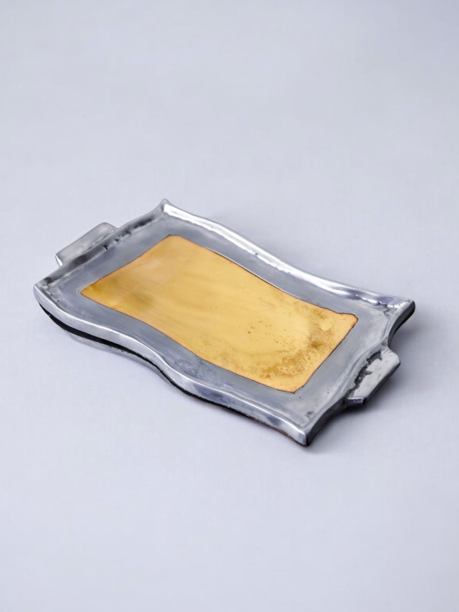 Brutalist pocket emptier by Leopold, bronze and aluminum 1970, Spain