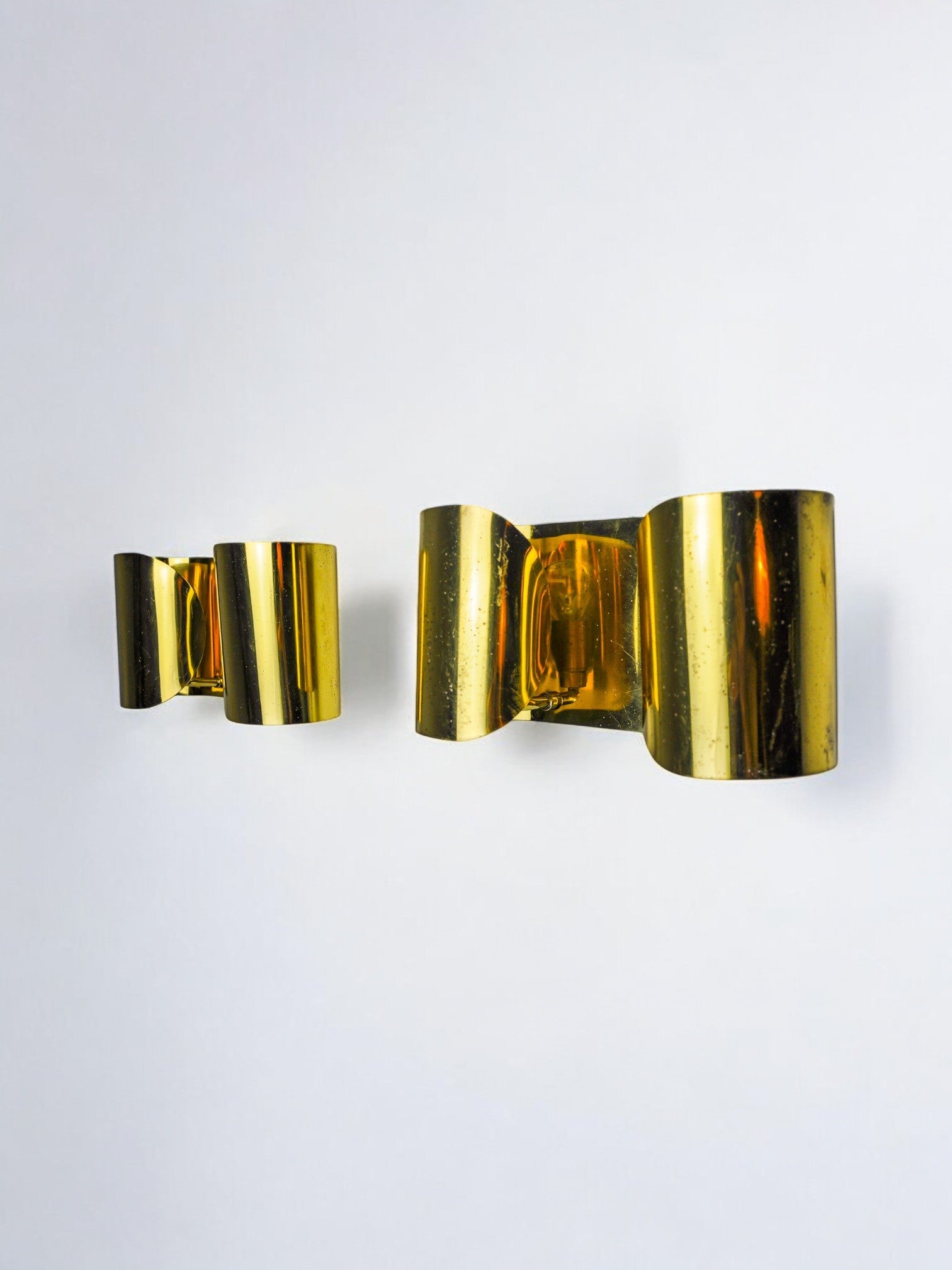 Pair of "Foglios" brass wall lights, Italy, 1970