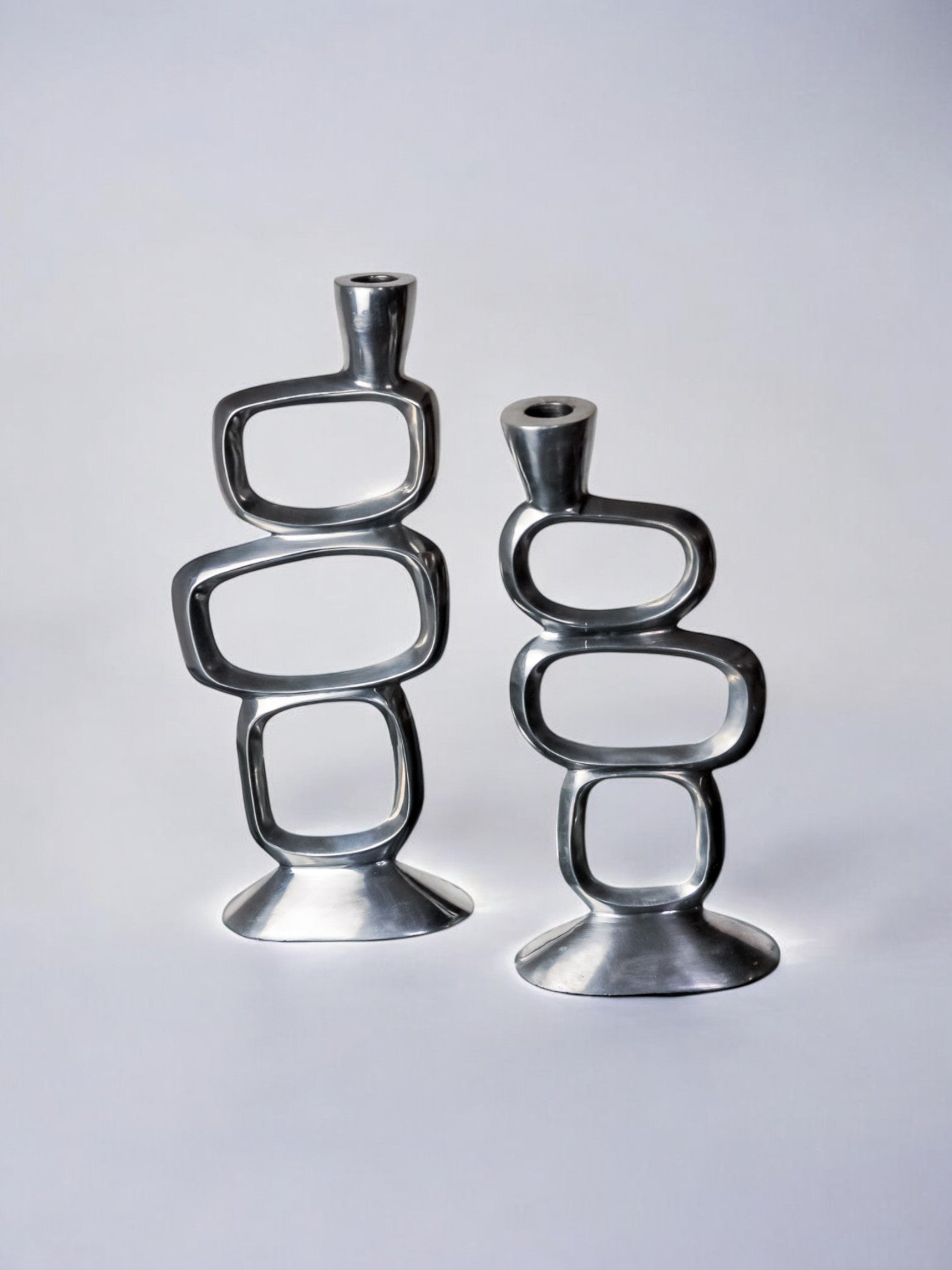 Pair of circle candlesticks by Matthew Hilton, England, 1980
