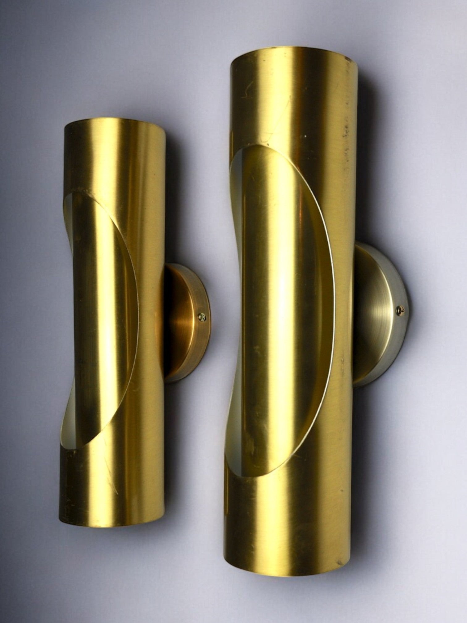 Pair of Raak tubular wall lamps in brass, 1970