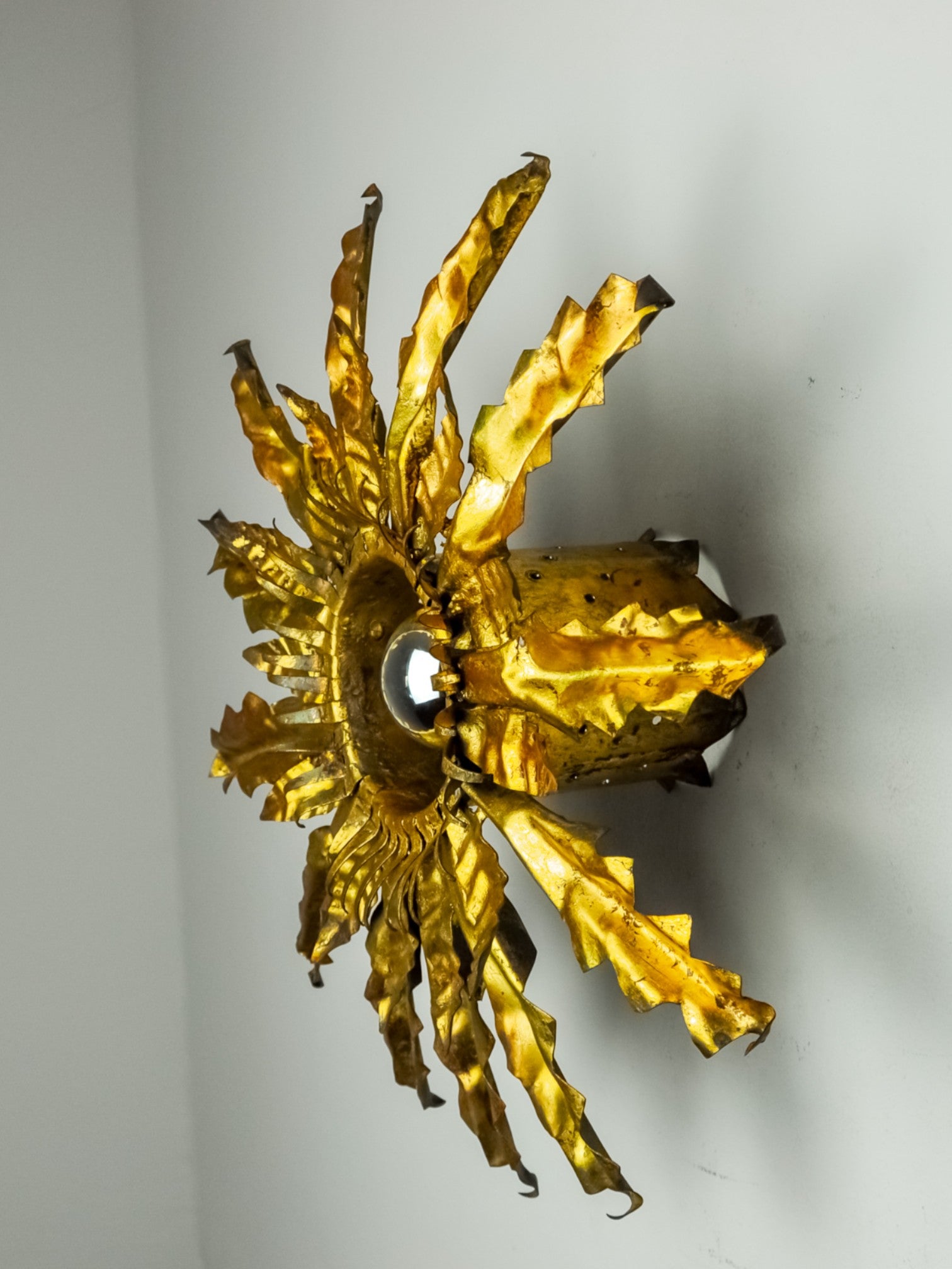 Brutalist sun wall lamp, metal and gold leaf, Italy, 1960
