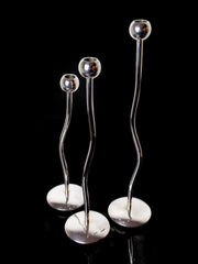 Trio of silver metal candlesticks from mesa italy, italy, 1980s
