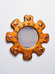 Sun shaped Modernist enamel mirror by J. Capo Esmaltes, Spain, 1970's