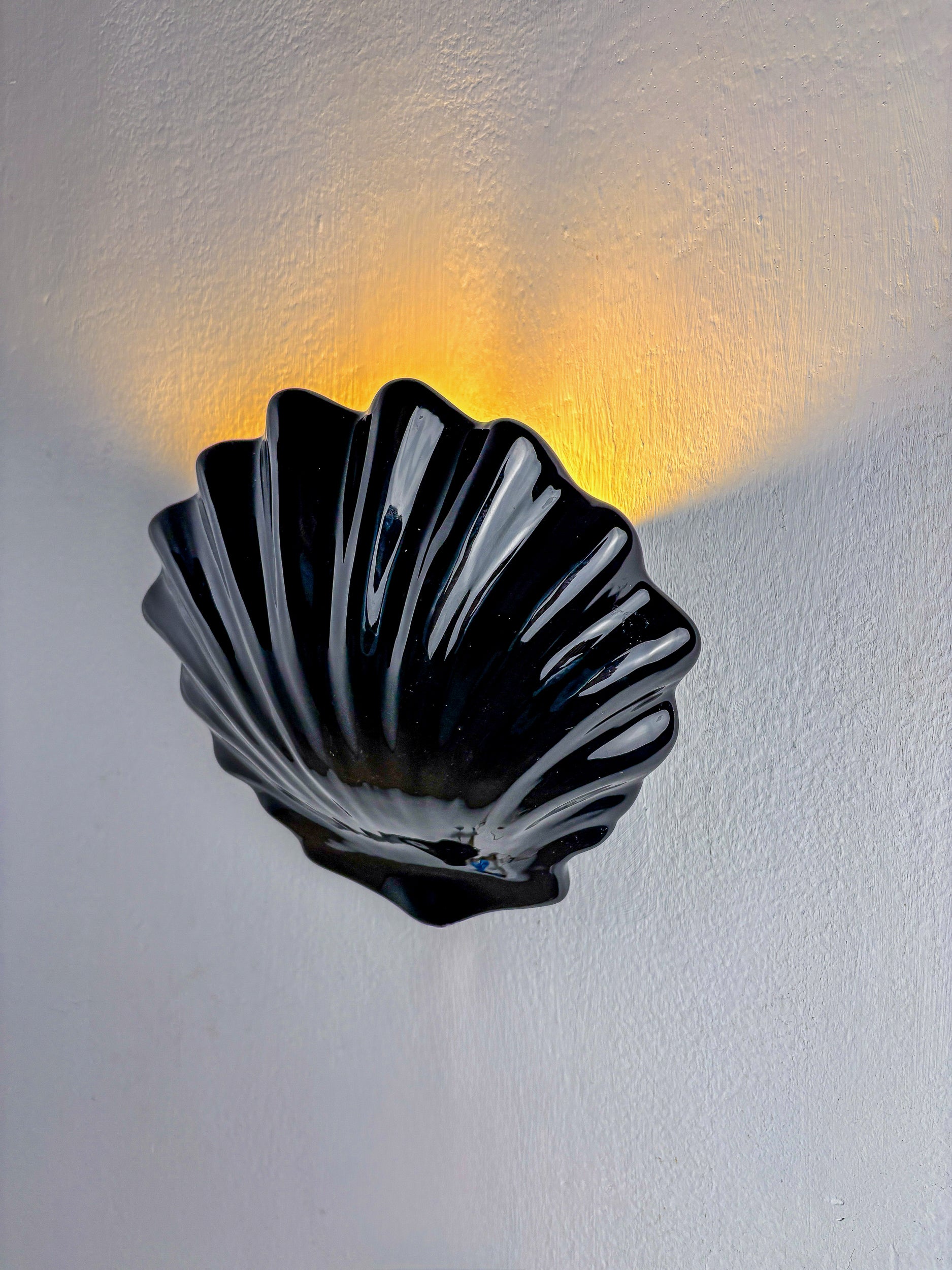Italian shell-shaped wall sconce, black ceramic, 1970's