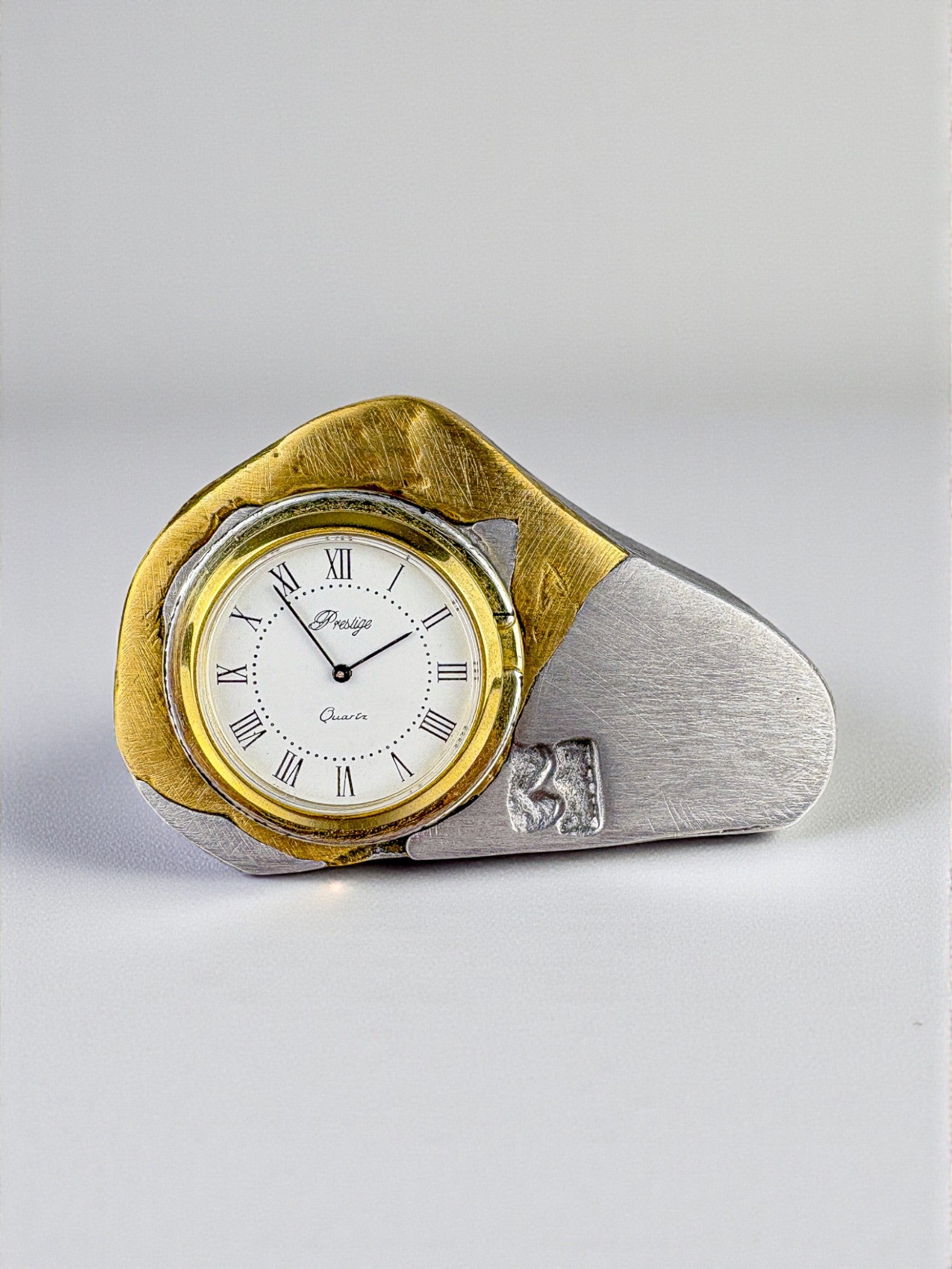 Brutalist clock by Art3, brass and aluminum, 1980's, Spain