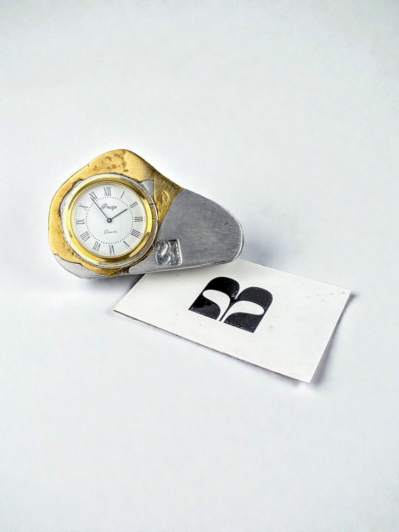 Brutalist clock by Art3, brass and aluminum, 1980's, Spain