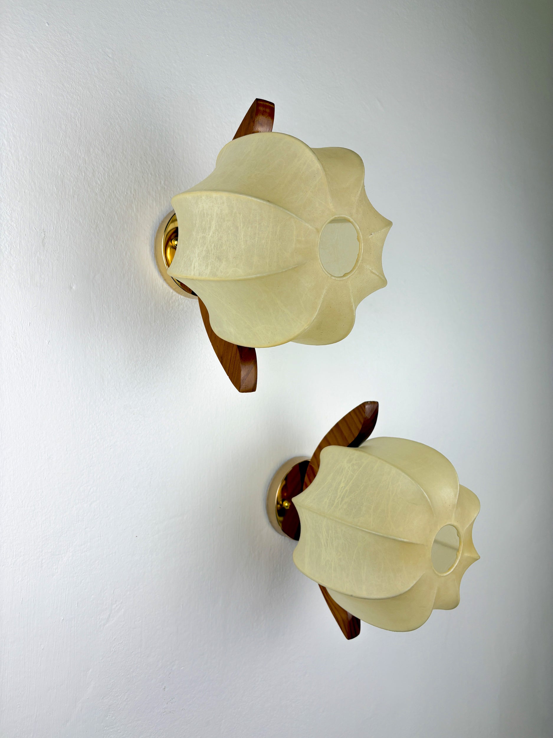 Pair of Italian "Cocoon" wall lights, resin and pine wood, 1970s