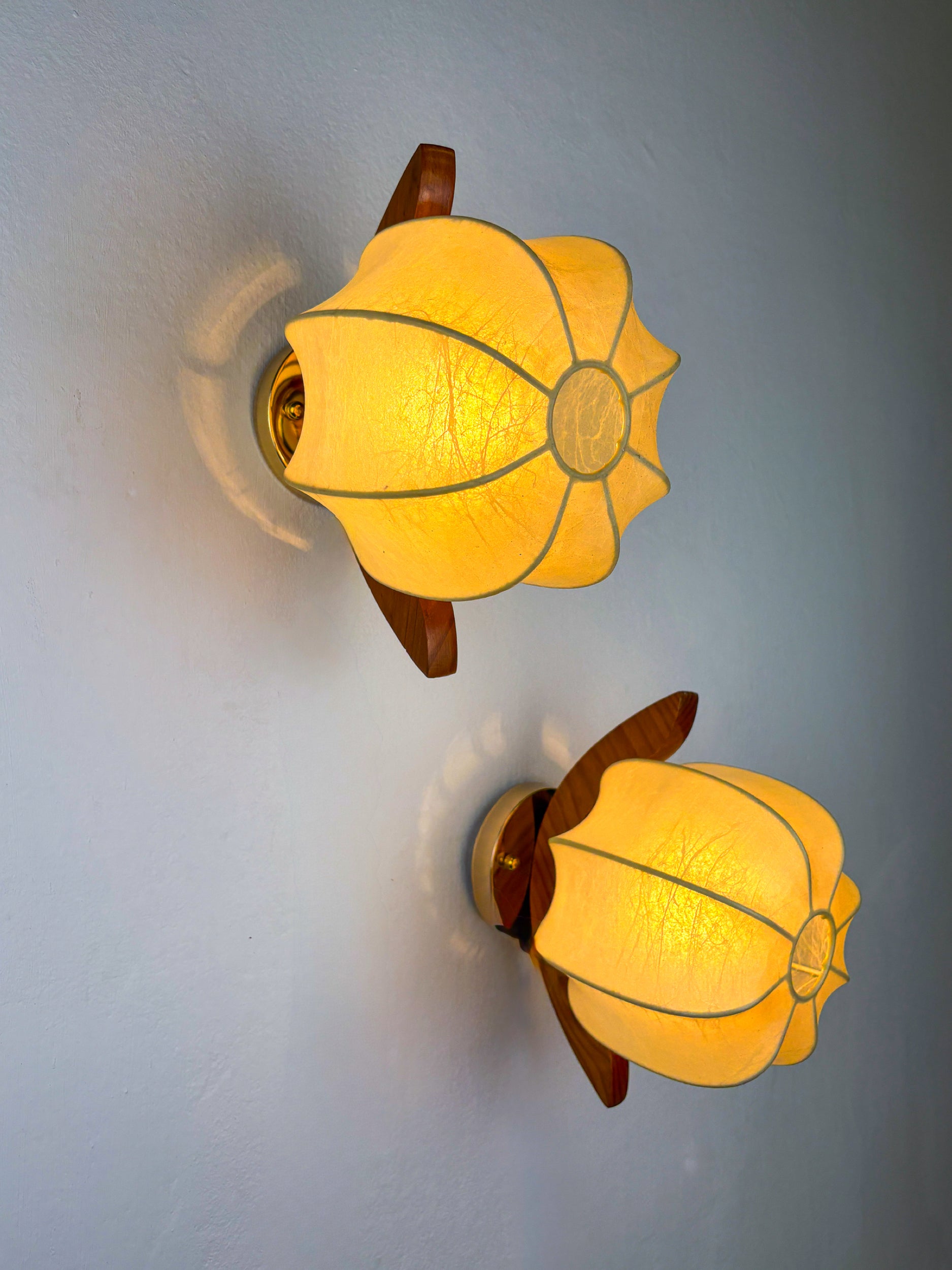 Pair of Italian "Cocoon" wall lights, resin and pine wood, 1970s