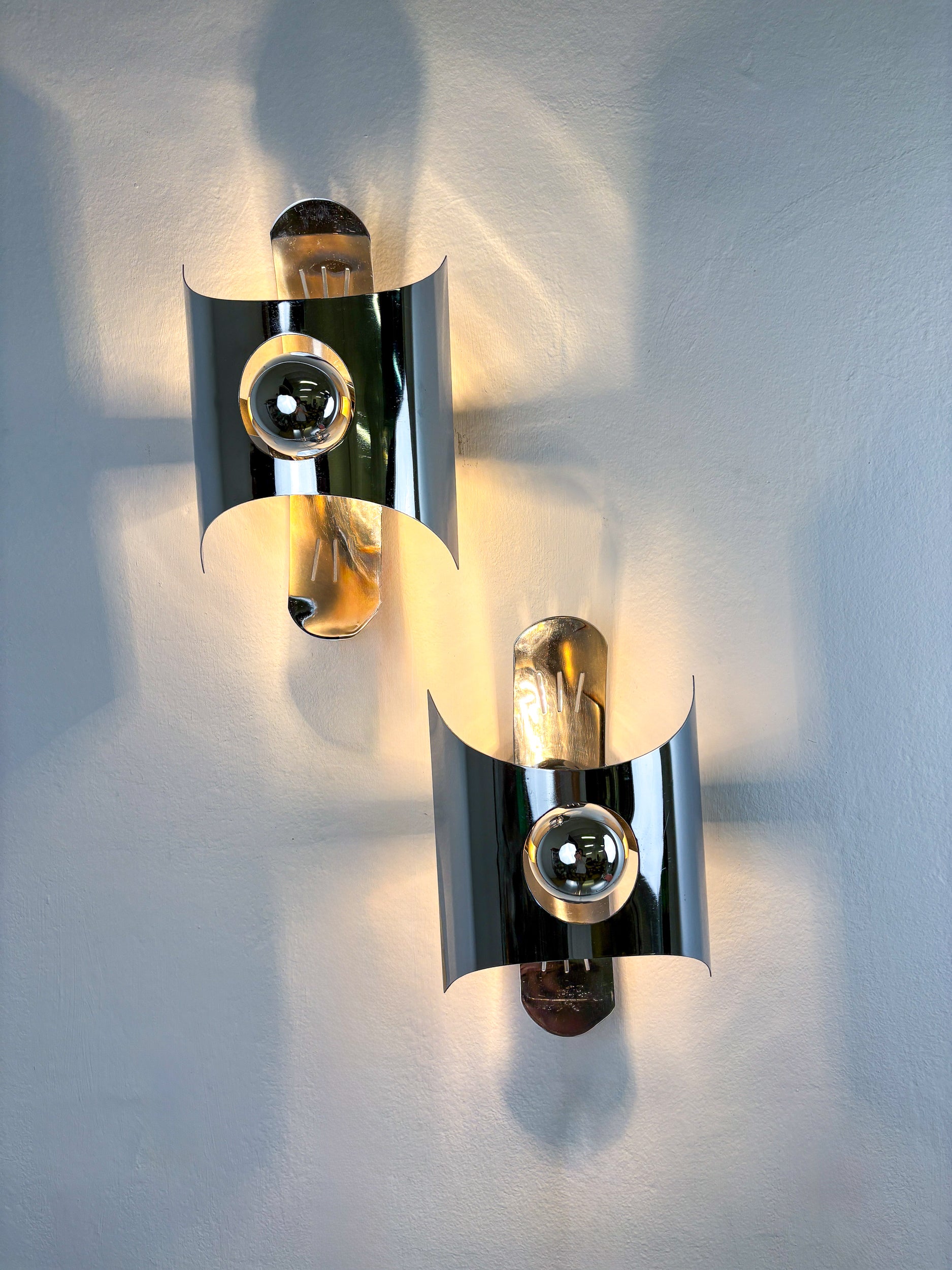 Pair of chromed space age wall lights, Italy, 1970's
