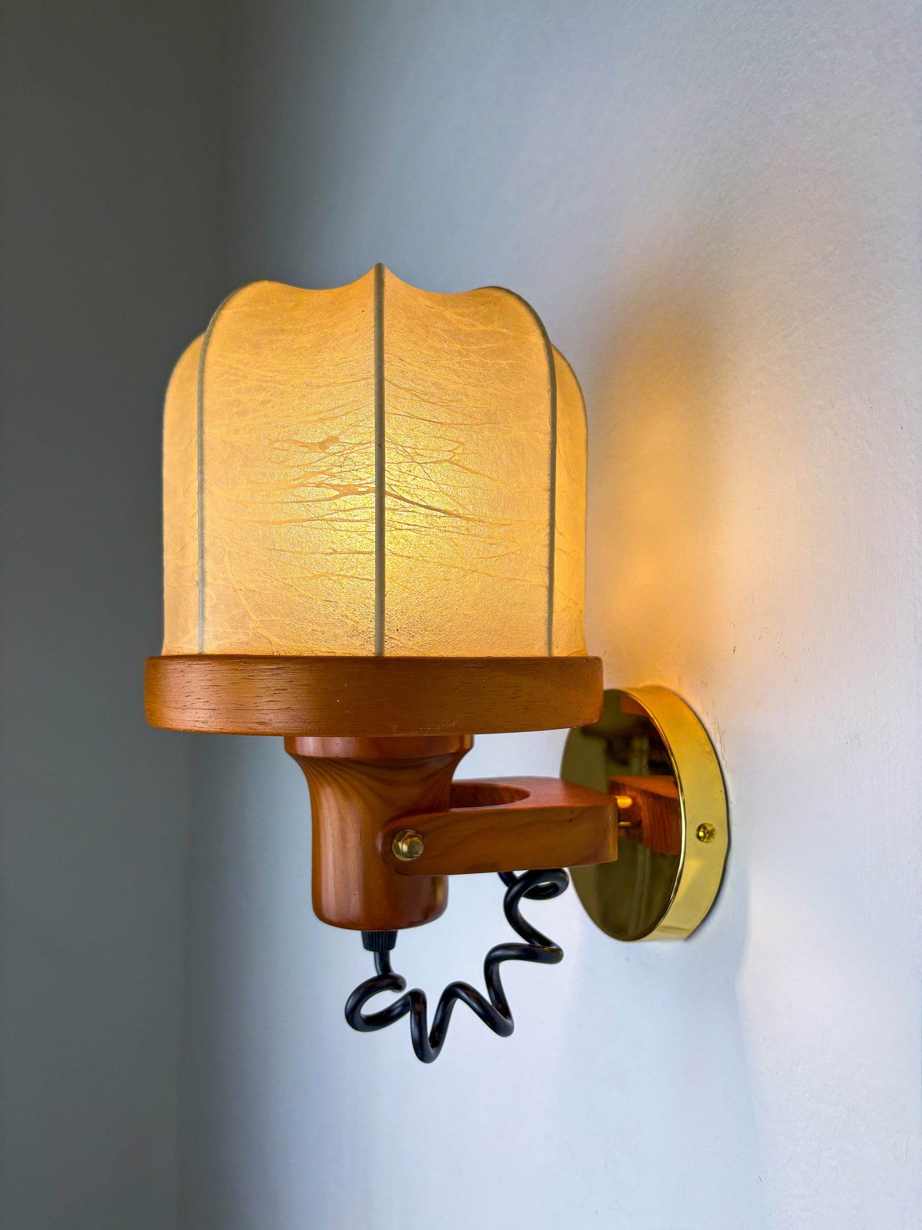 Pair of articulated "Cocoon" wall lights in resin and pine, Italy, Circa 1970's