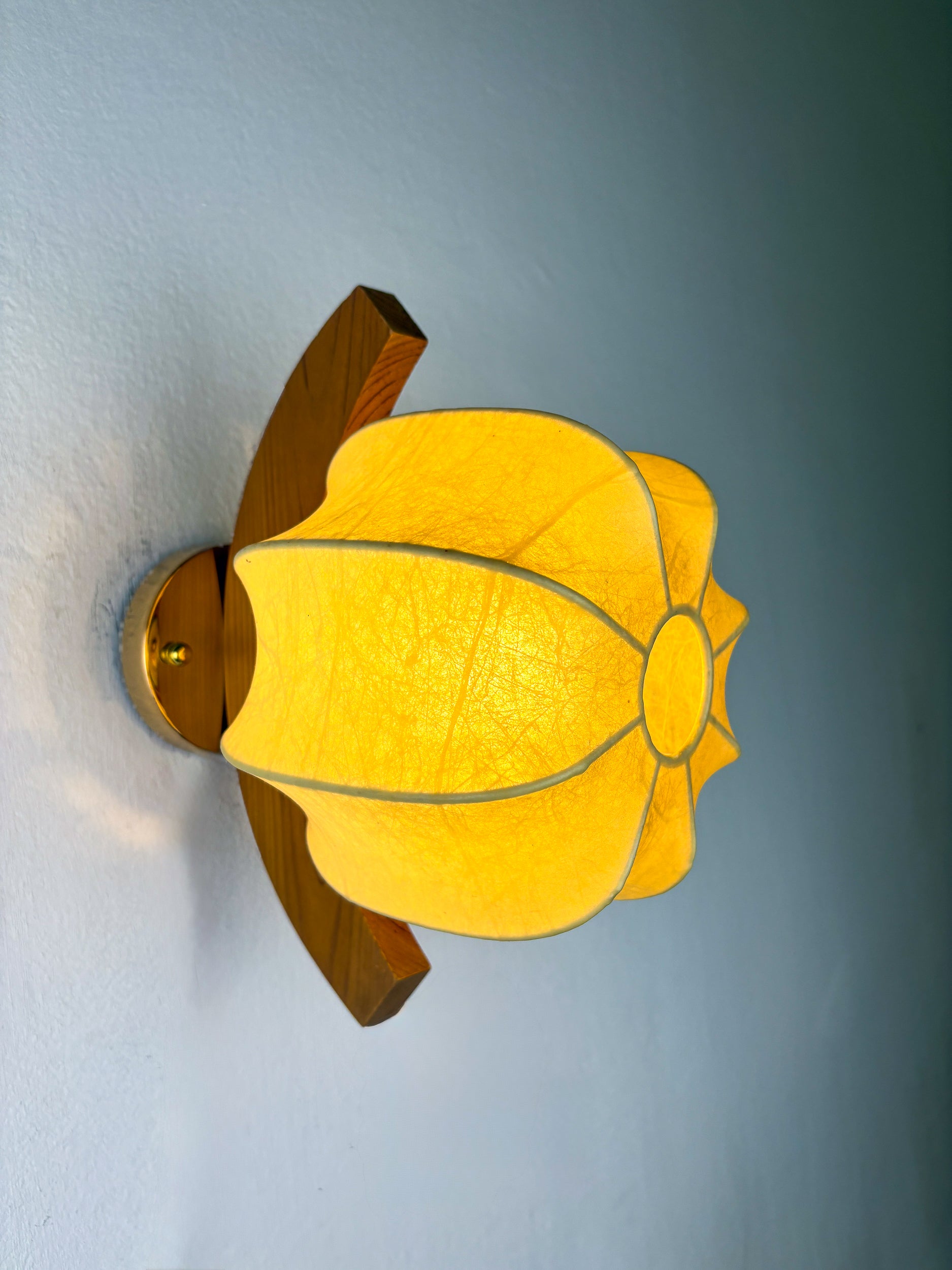 Pair of "Cocoon" wall lights, resin and pine, Italy, 1970's