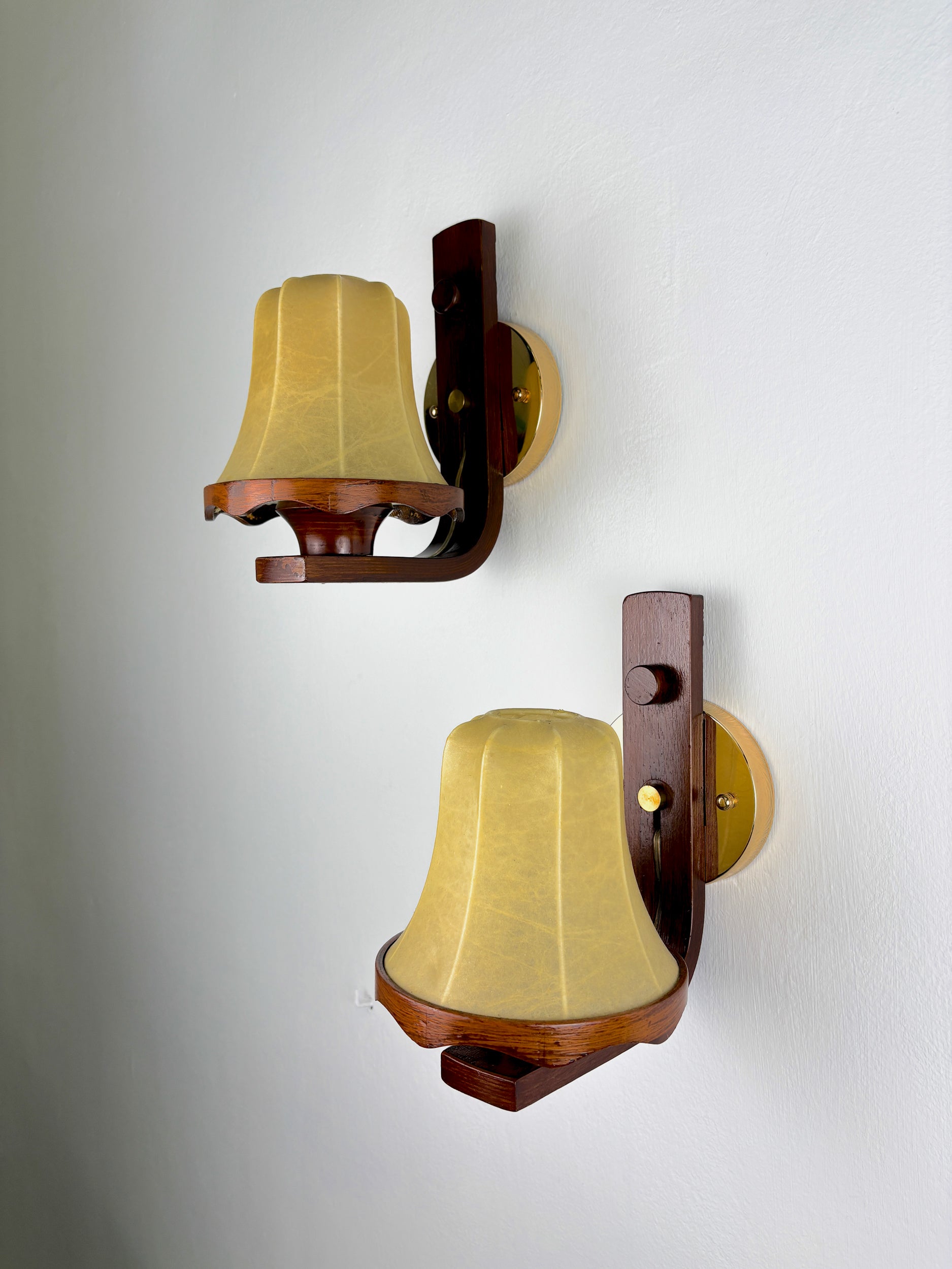 Pair of Italian "Cocoon" wall lights, resin and wood, 1970s