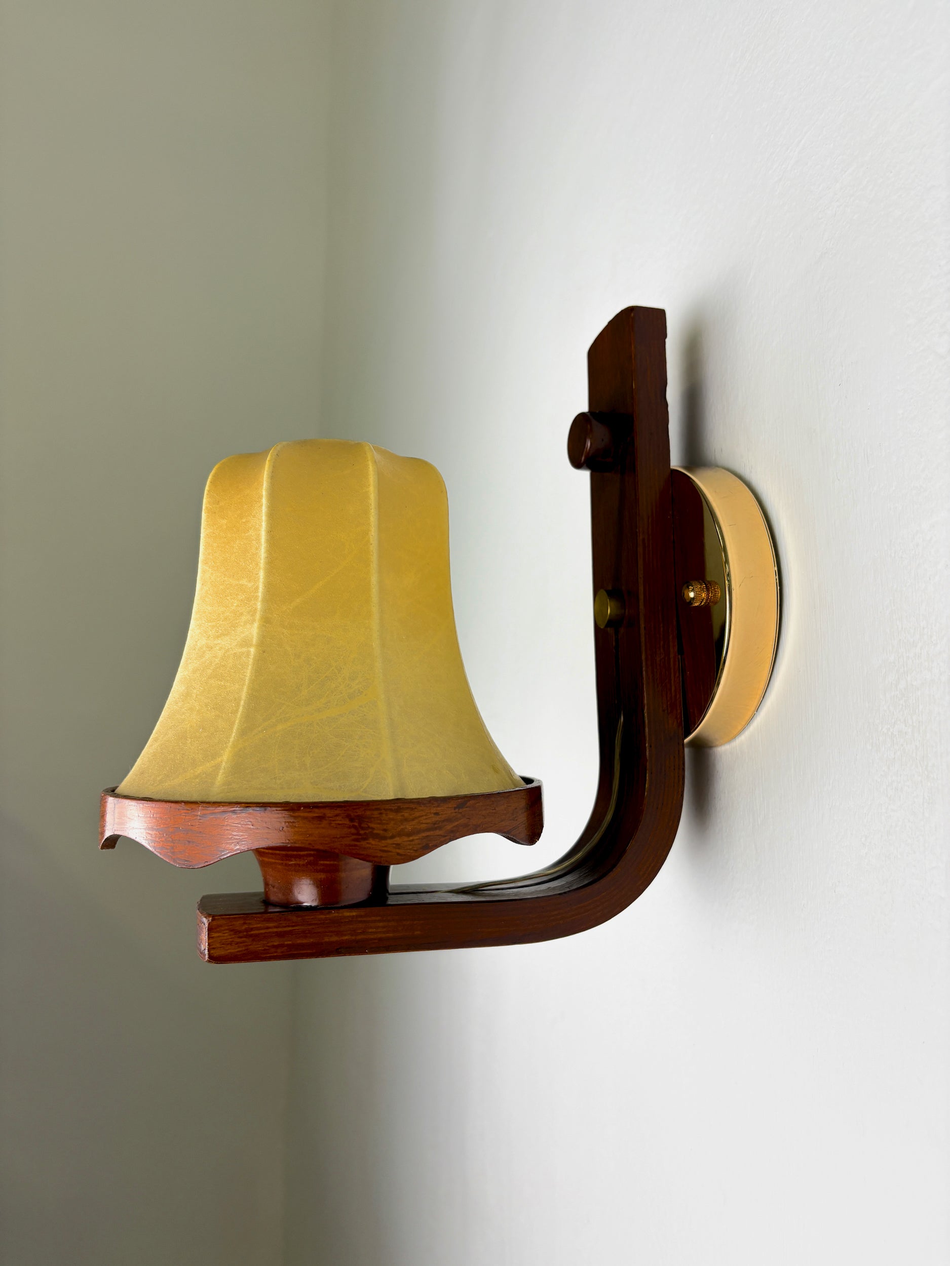 Pair of Italian "Cocoon" wall lights, resin and wood, 1970s