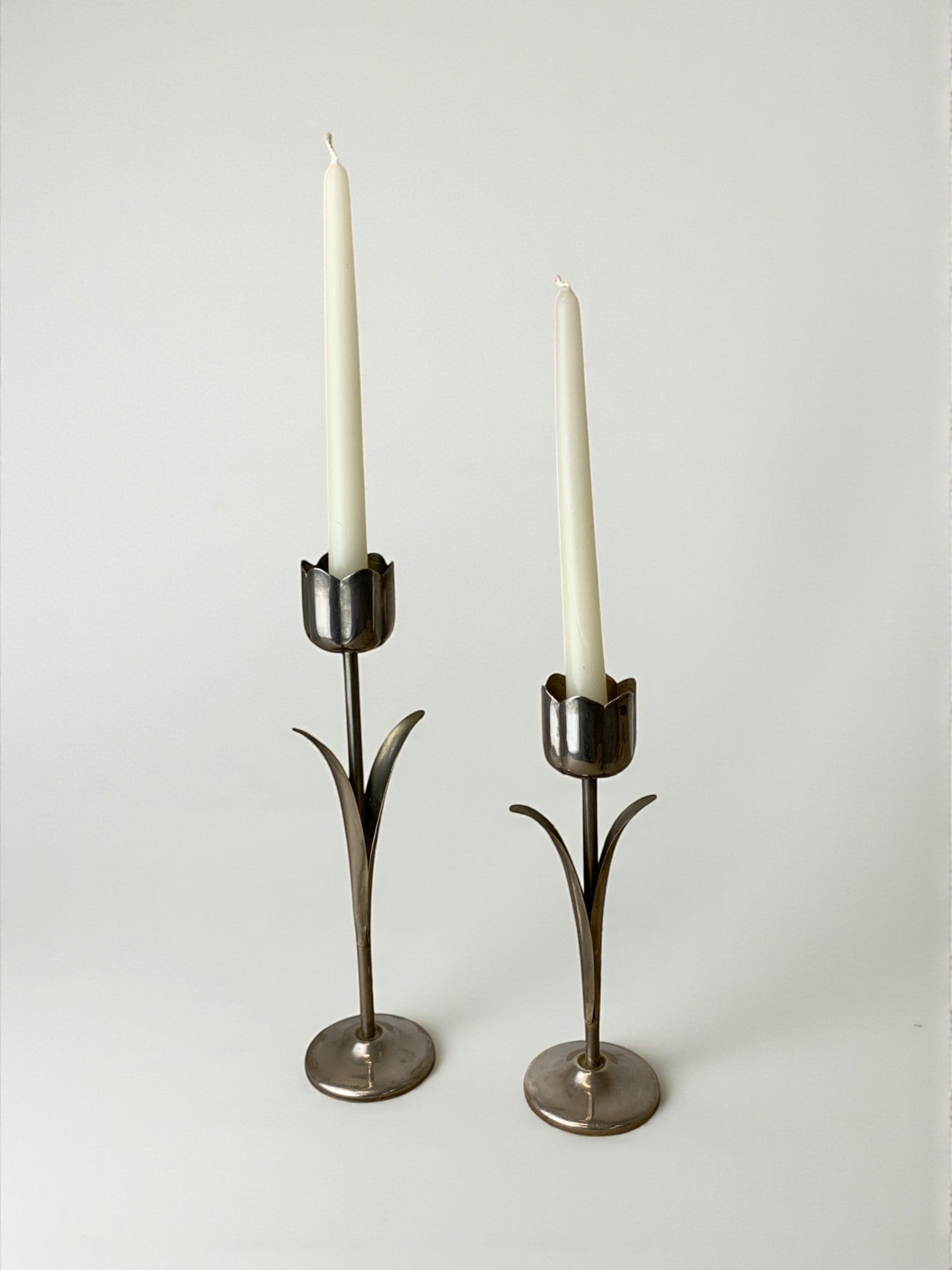 Pair of chromed tulip candle holders, 1970's, Italy