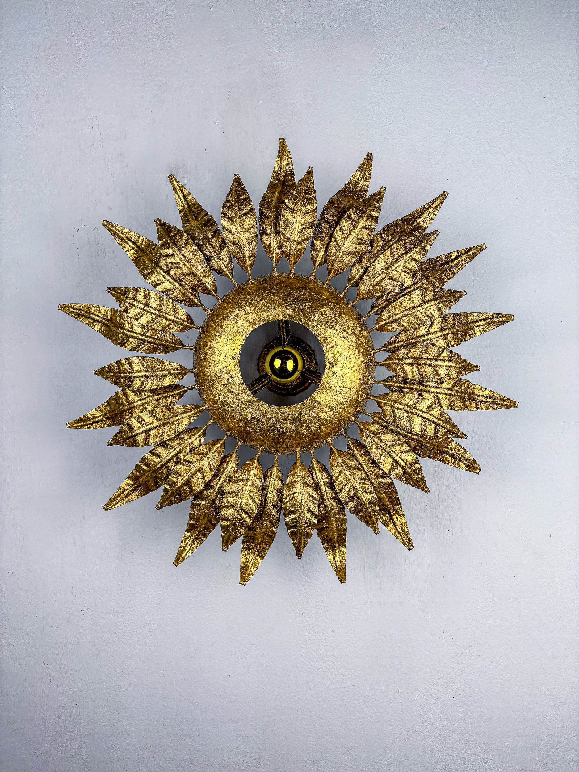 Spanish Sunburst ceiling light fixture or sconce in Gilt Wrought Iron, Circa 1950's