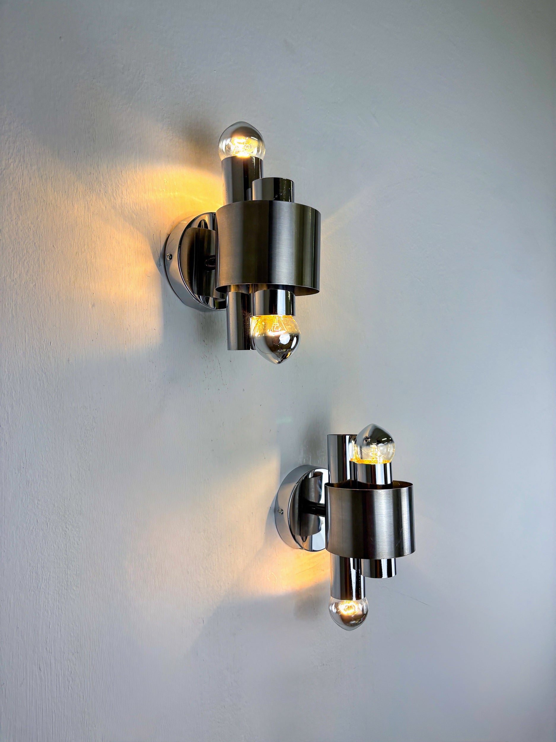 Pair of space age 2-light wall sconces, chromed metal, Italy, 1970's