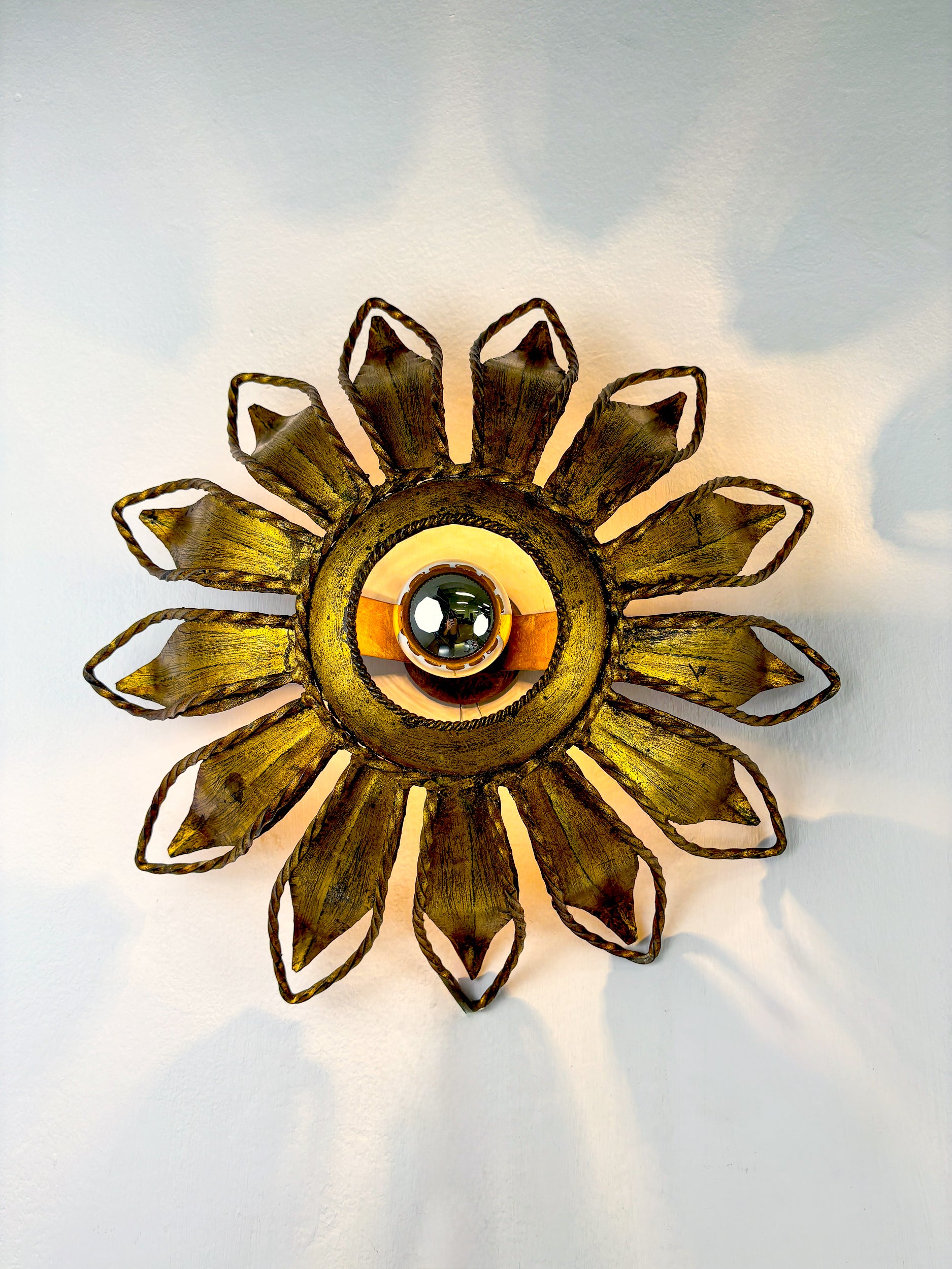Spanish Sunburst ceiling light fixture or sconce in Gilt Iron, Circa 1960