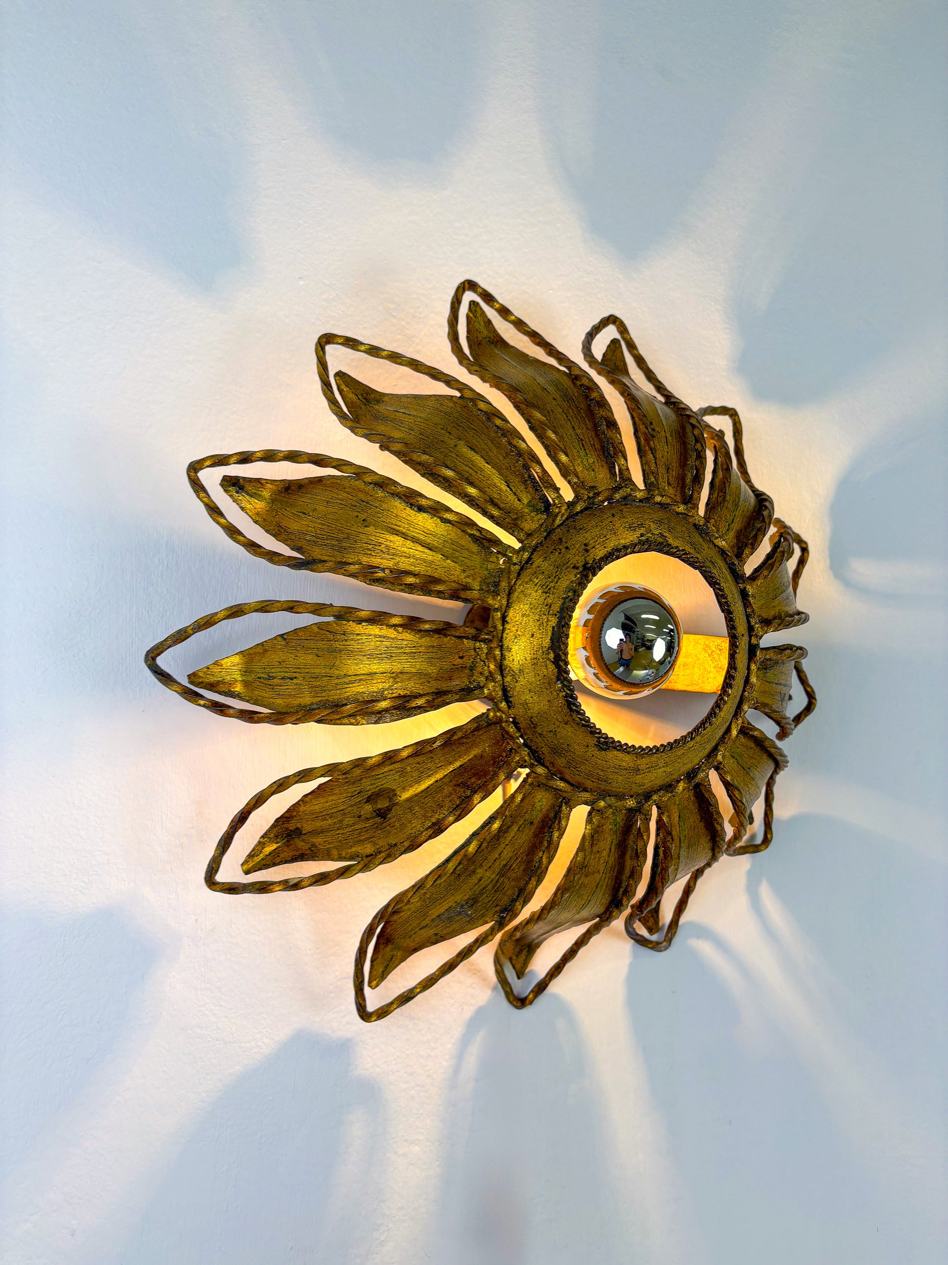 Spanish Sunburst ceiling light fixture or sconce in Gilt Iron, Circa 1960