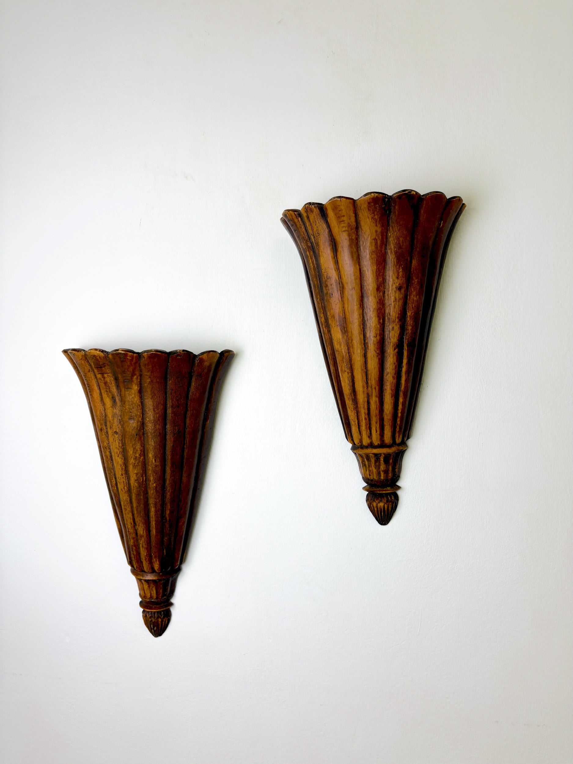 Pair of Art Deco carved wood wall sconces, France, 1930's