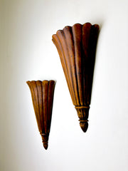 Pair of Art Deco carved wood wall sconces, France, 1930's