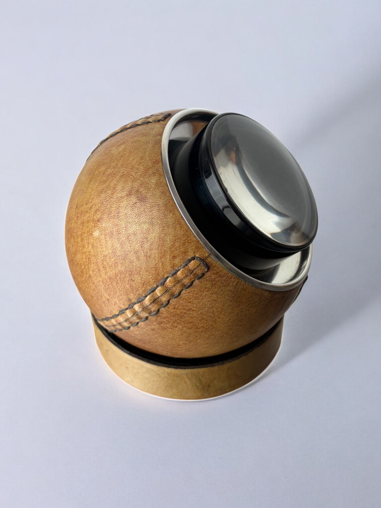 Circular cigarette box with support in leather, Spain, 1980's