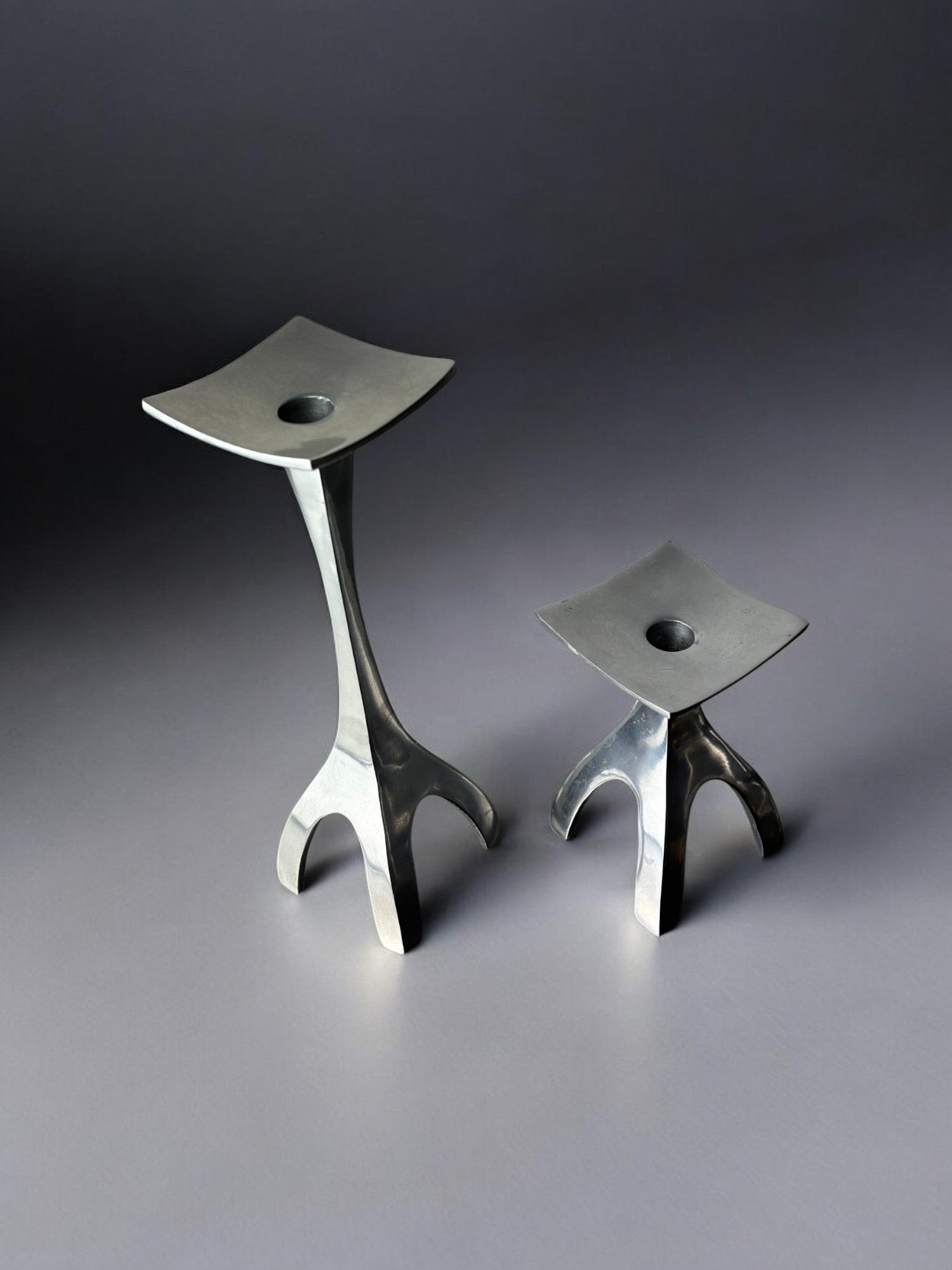 Pair of Biomorphic candleholders, solid aluminum, Spain, 1970's