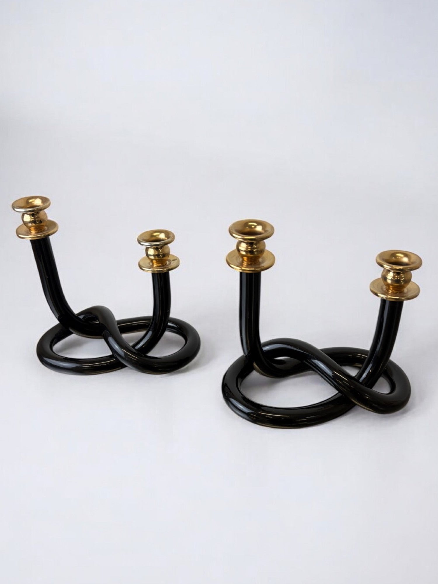 Pair of Black pretzel candlesticks by Dorothy Thorpe, Circa 1970's