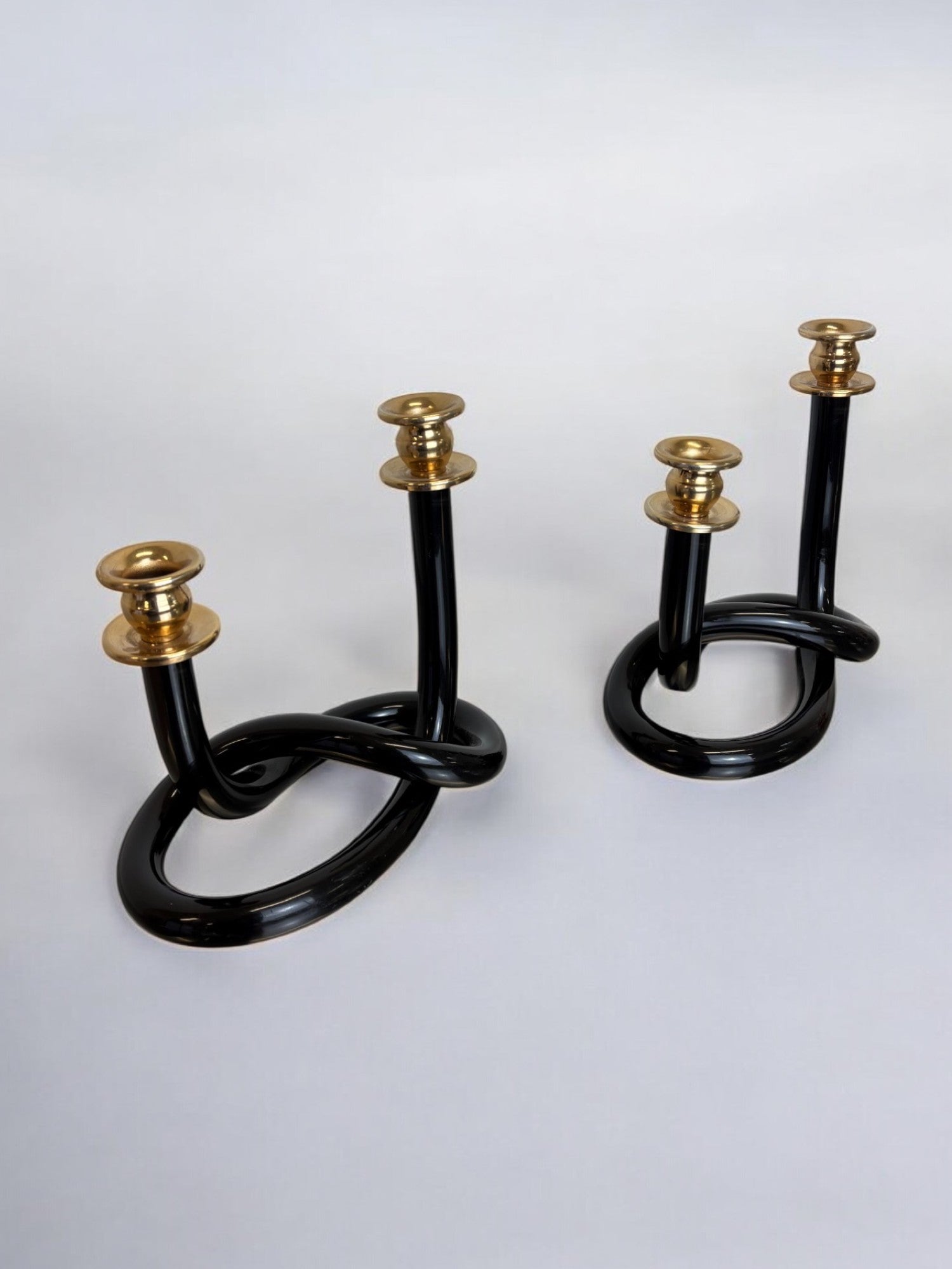 Pair of Black pretzel candlesticks by Dorothy Thorpe, Circa 1970's