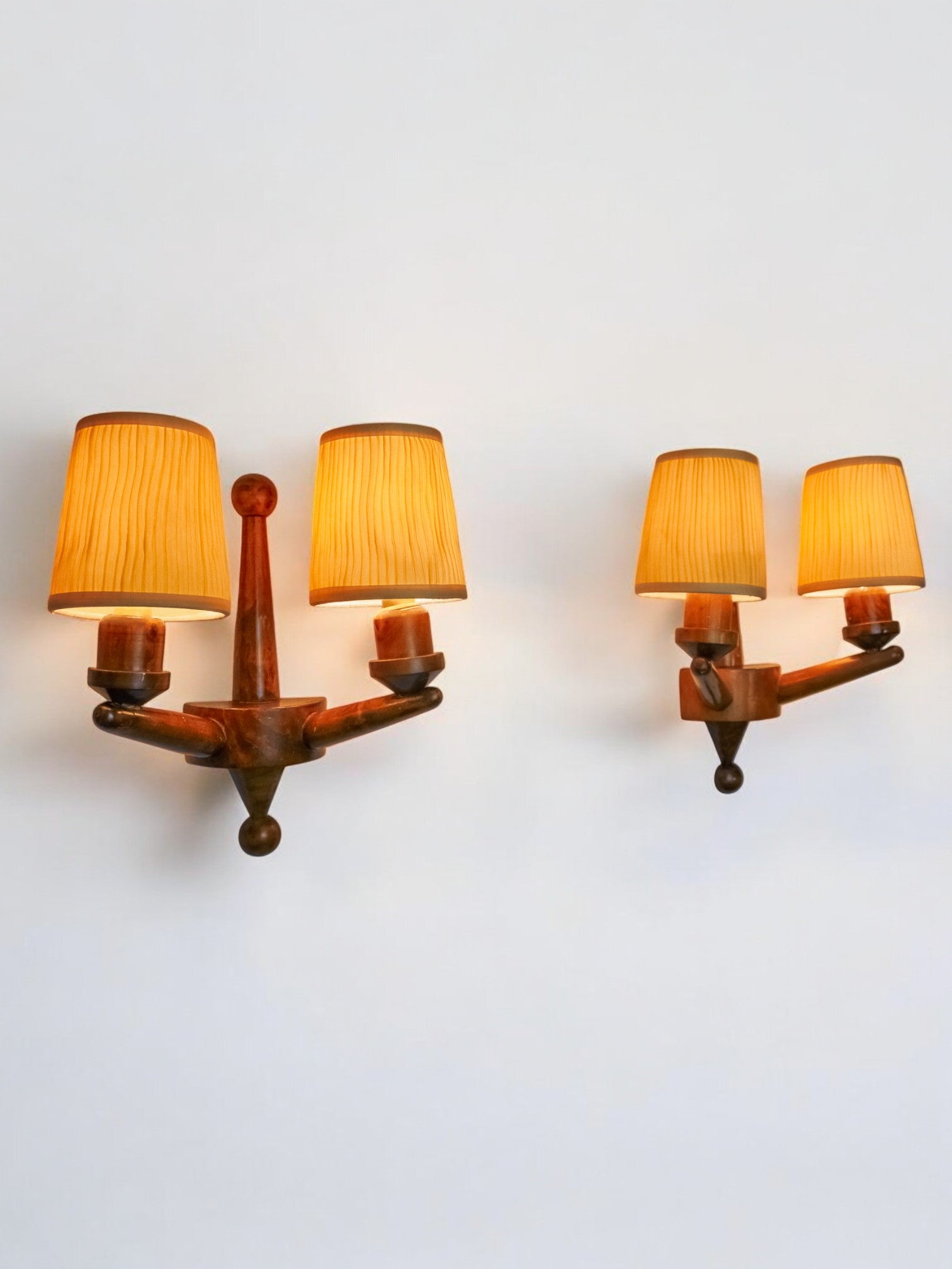 Pair of two-armed art deco wall lights, carved wood, France, 1960