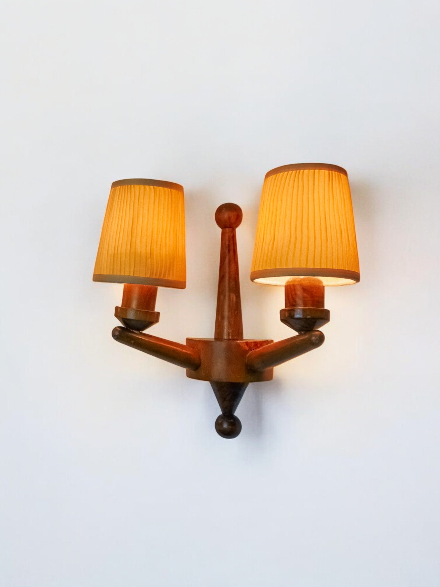 Pair of two-armed art deco wall lights, carved wood, France, 1960