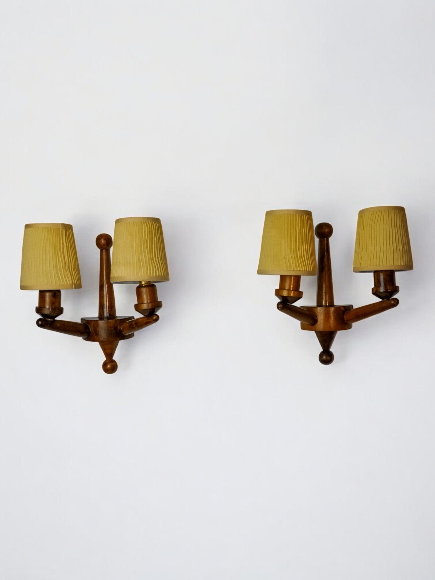 Pair of two-armed art deco wall lights, carved wood, France, 1960
