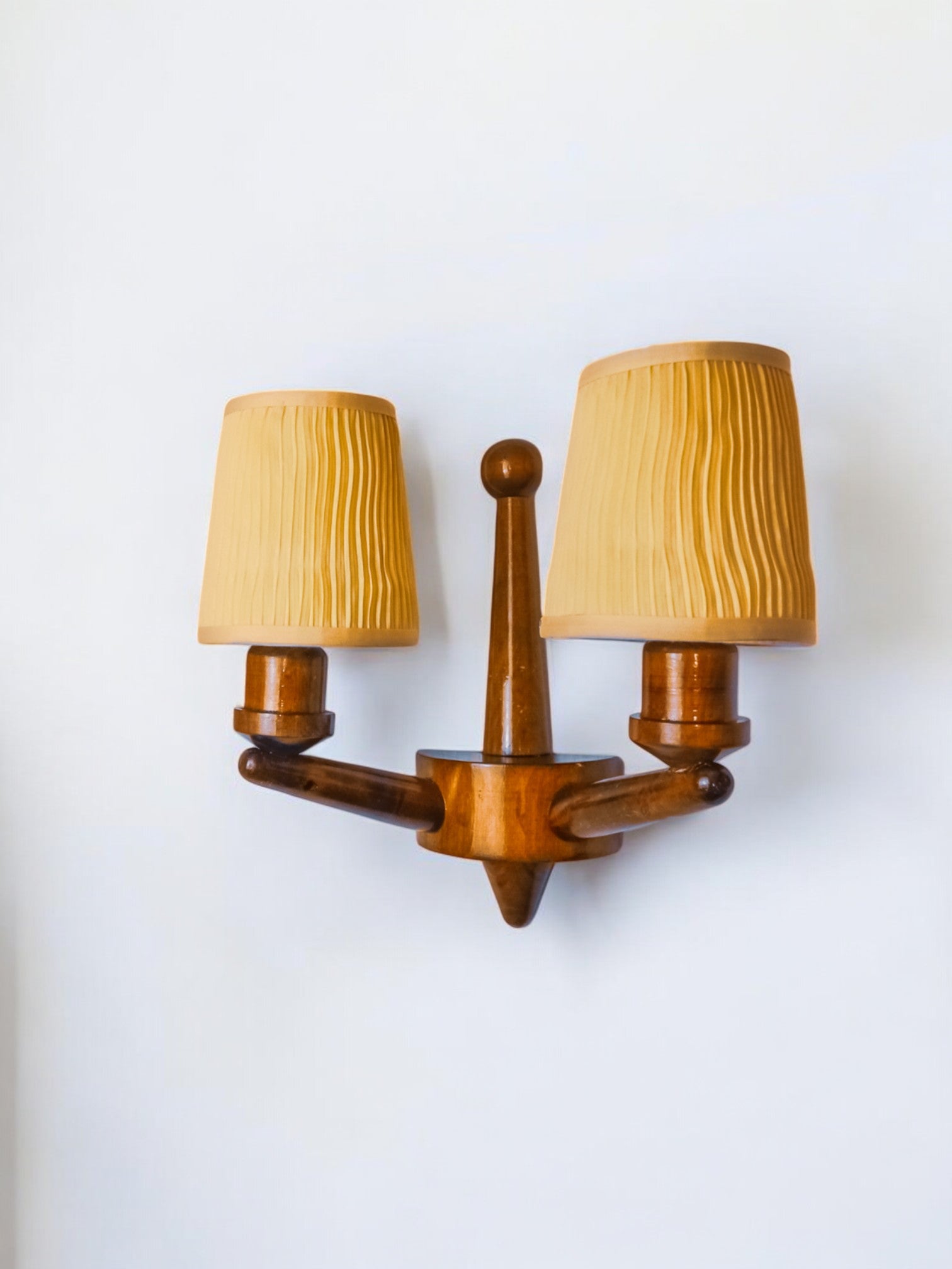 Pair of two-armed art deco "ball" wall lights, carved wood, France, 1960