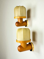 Pair of Italian "Cocoon" wall lights, resin and pine wood, 1970s