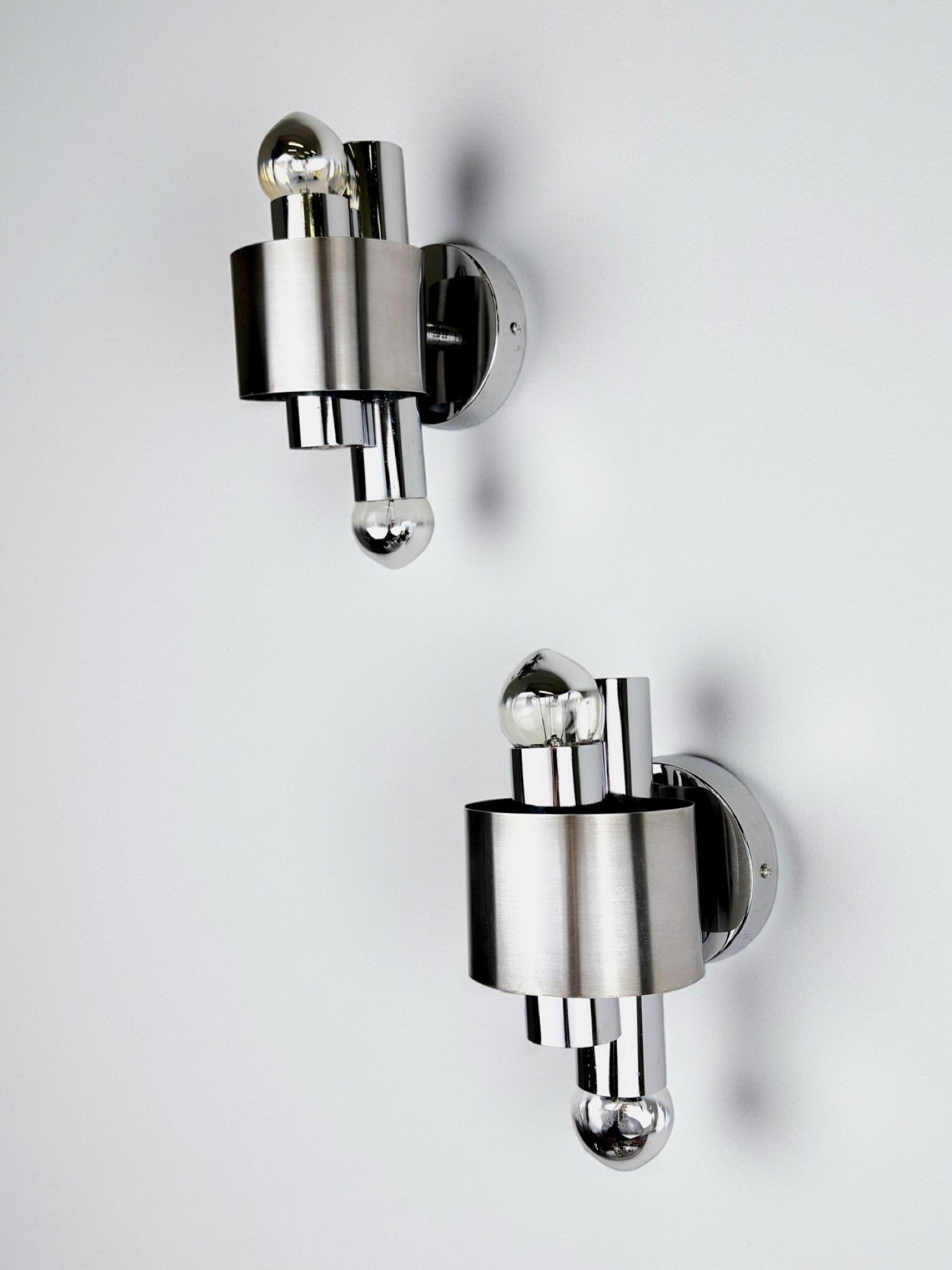 Pair of space age 2-light wall sconces, chromed metal, Italy, 1970's