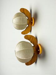 Pair of Italian "Cocoon" wall lights, resin and pine wood, Circa 1970