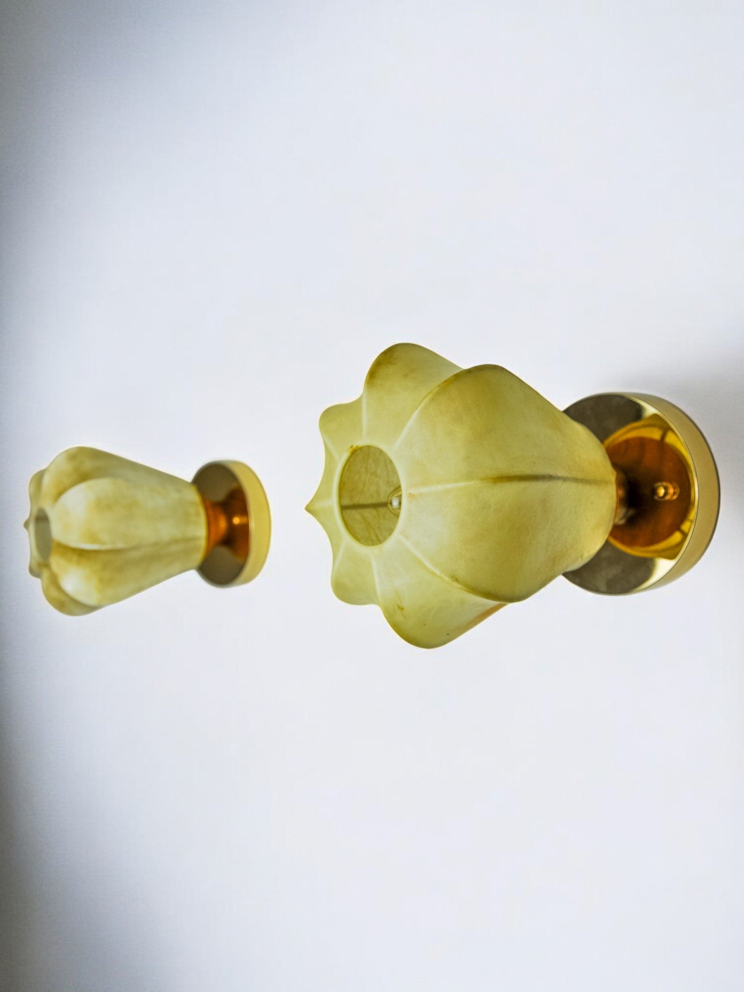 Pair of "Cocoon" wall lights, in resin and pine, Italy, 1970