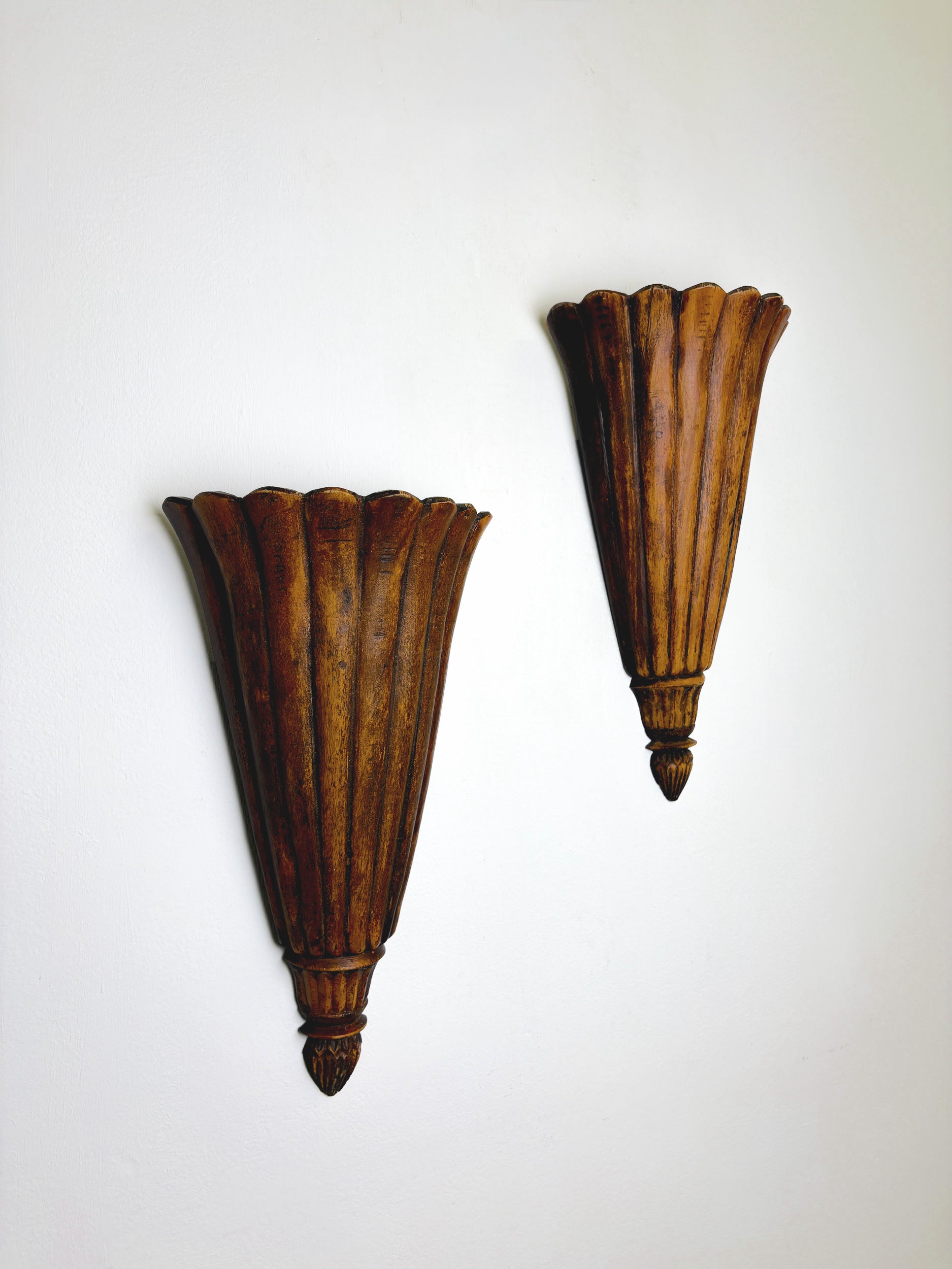 Pair of Art Deco carved wood wall sconces, France, 1930's