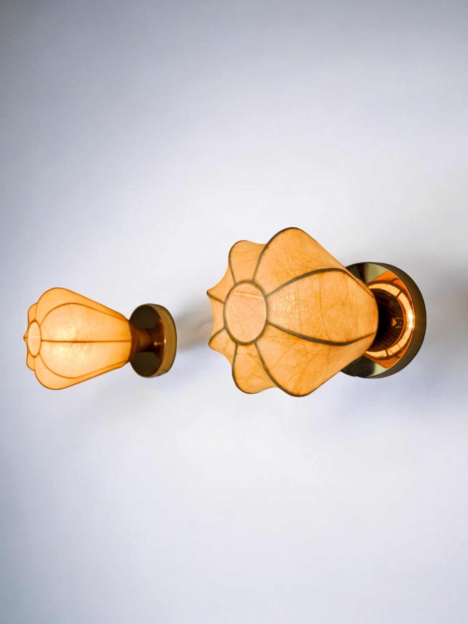 Pair of "Cocoon" wall lights, in resin and pine, Italy, 1970