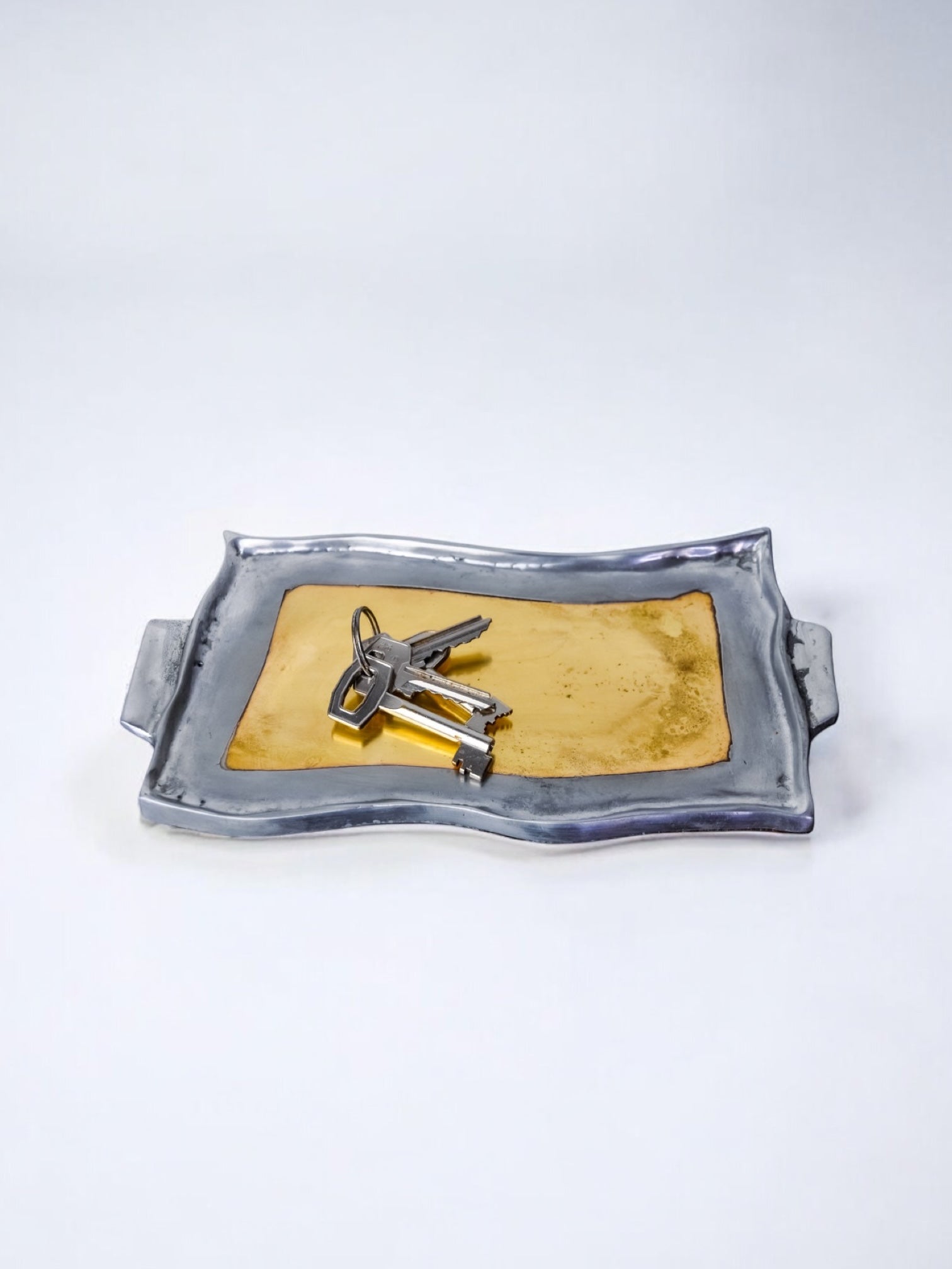 Brutalist pocket emptier by Leopold, bronze and aluminum 1970, Spain