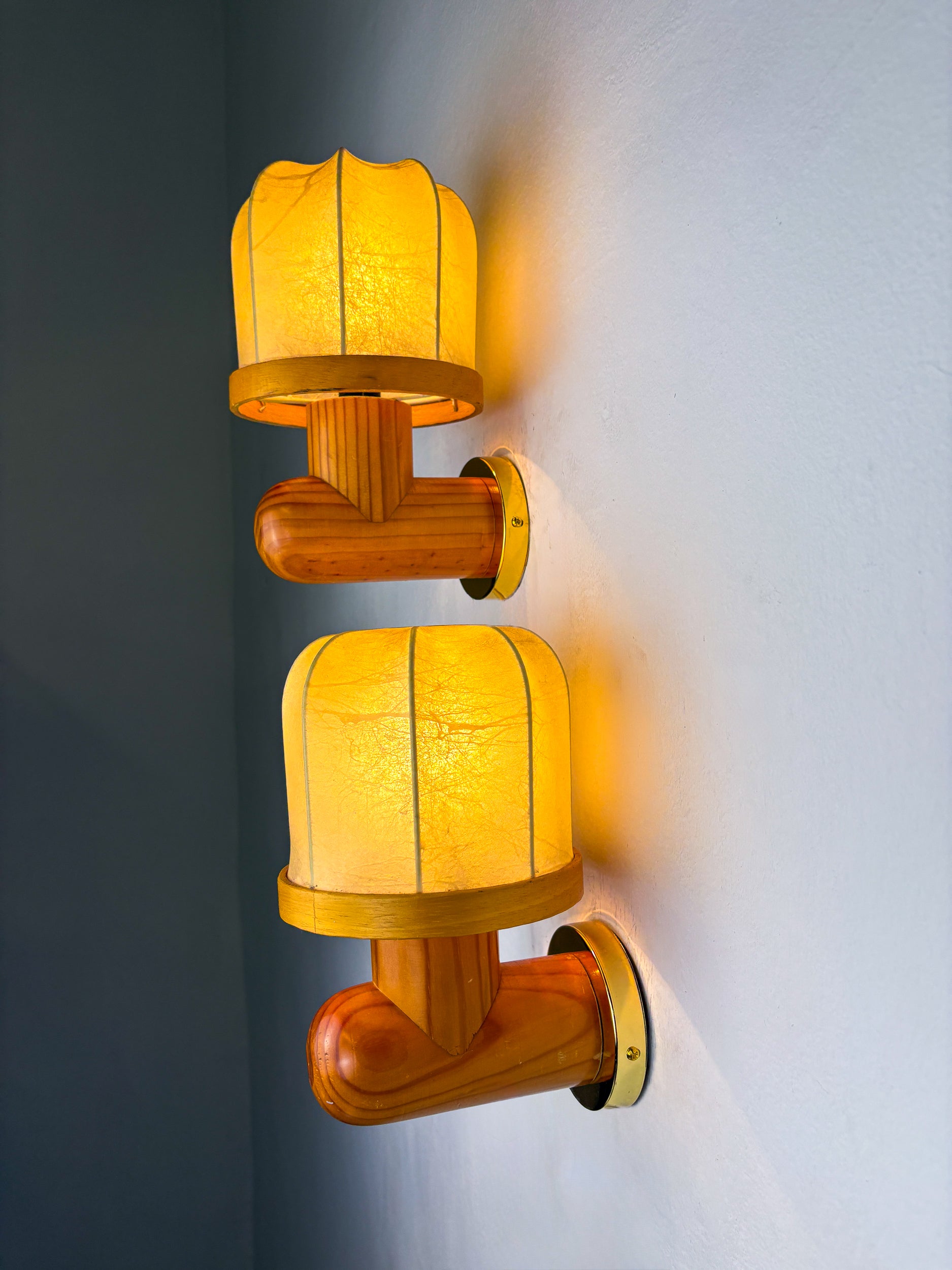Pair of Italian "Cocoon" wall lights, resin and pine wood, 1970s
